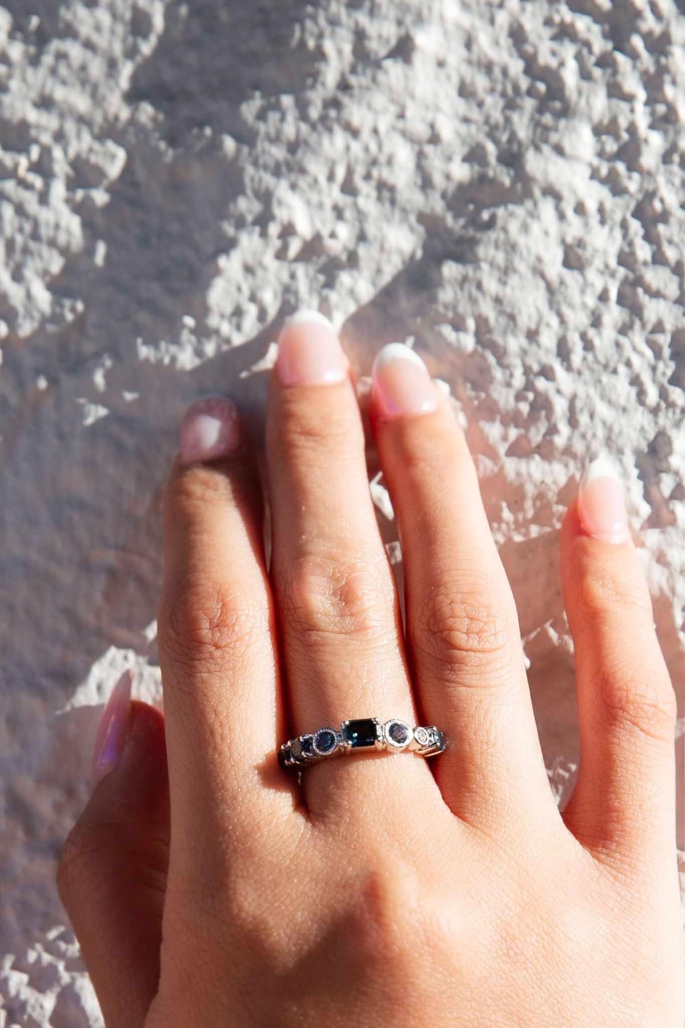 From our Freedom range, The Addie Ring is a joyful celebration of design and colour. Stunningly crafted in 18 carat white gold she reminds us of bright summer skies and midnight seas. Six stunning sapphires and one sparkling diamond set differently