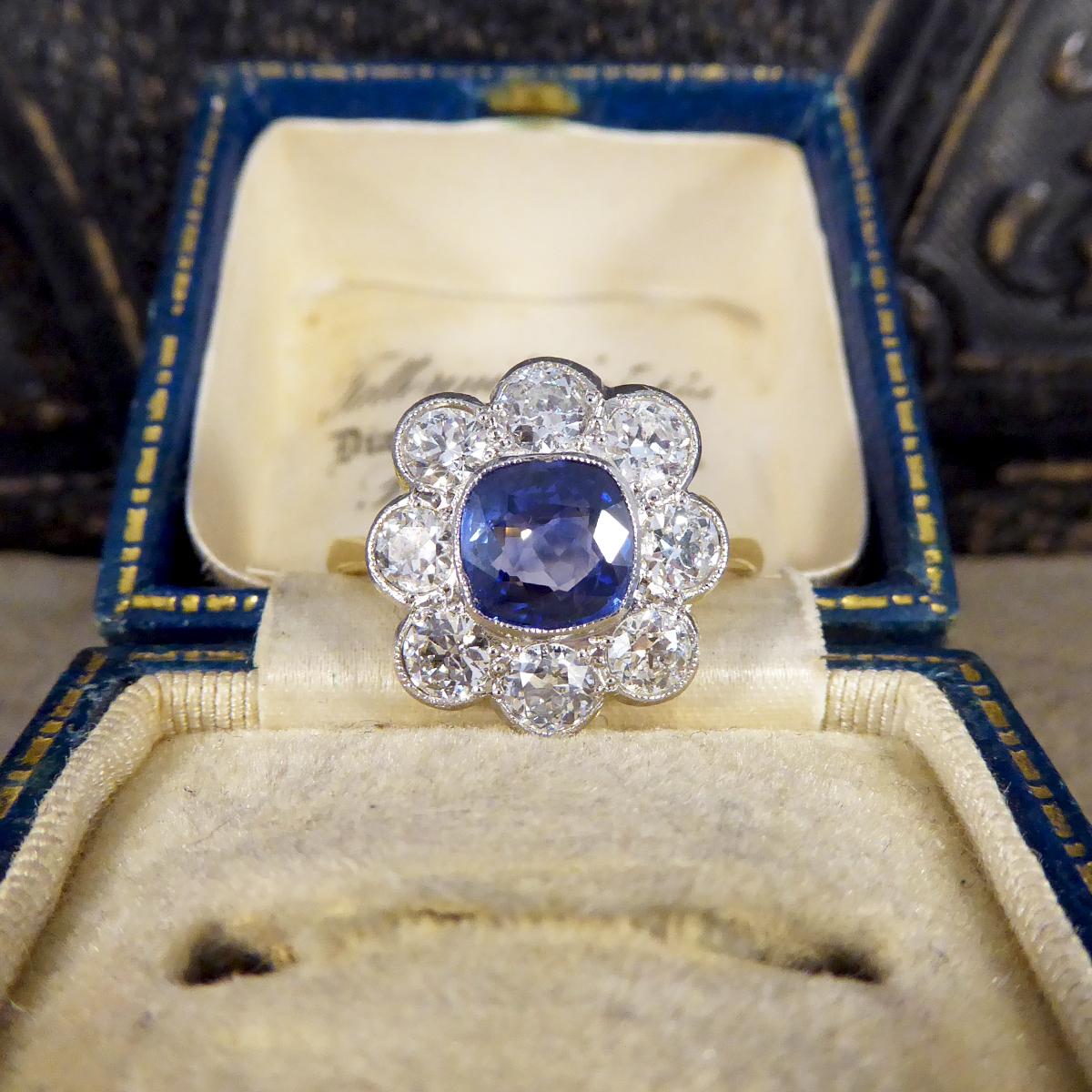 Contemporary 1.40ct Sapphire and 1.35ct Diamond Cluster Ring in 18ct Gold In Good Condition In Yorkshire, West Yorkshire