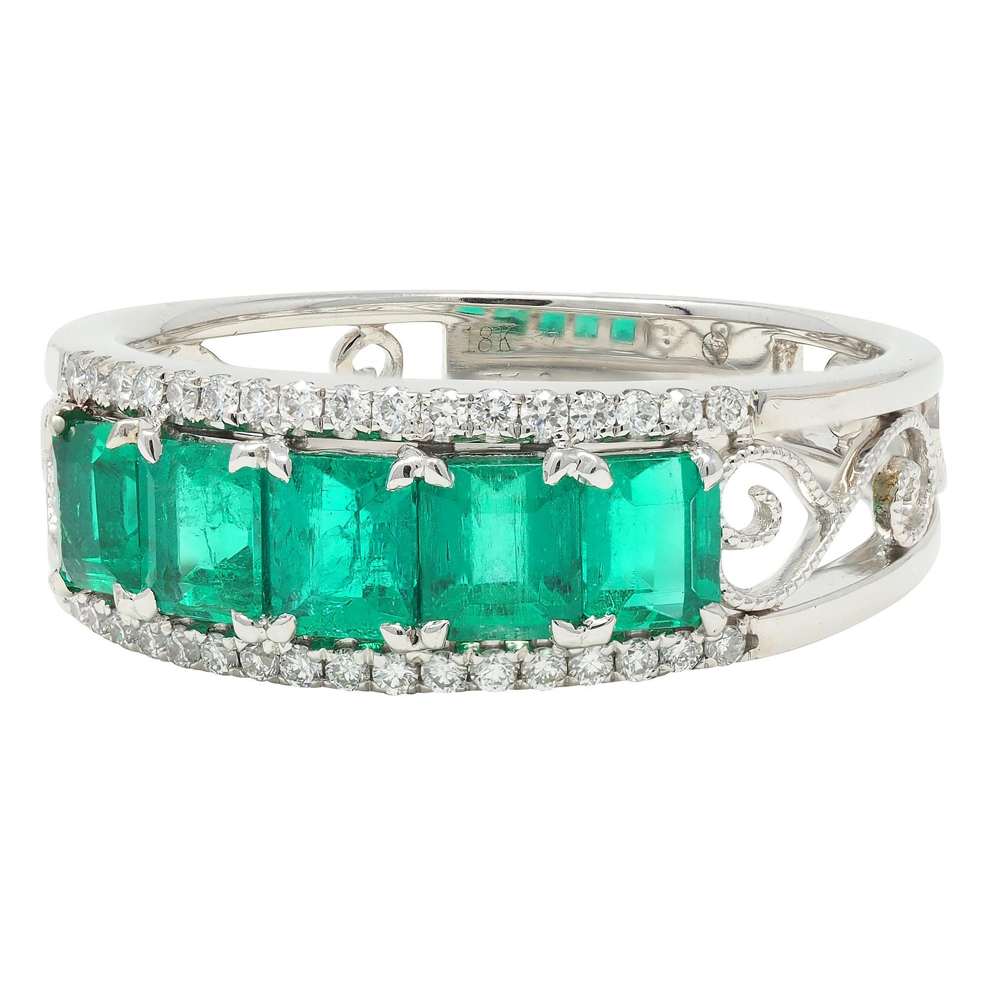 Featuring five emerald cut emeralds weighing 1.30 carat total 
Transparent medium green in color and prong set to front
Flanked north to south by rows of round brilliant cut diamonds
Weighing approximately 0.17 carat total - eye clean and