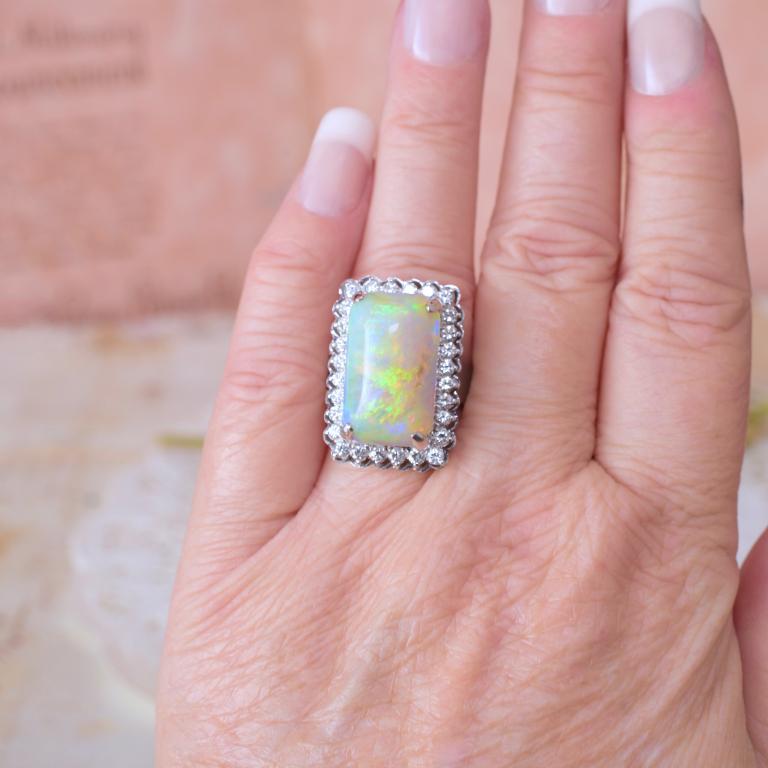 Independent Valuation Included With Purchase $12,400 AUD

A truly outstanding likely custom made ring given the superb choice of Opal, in this case an en cabochon, solid white Opal of approx 12.3cts (Gemological Association of Australia nomenclature