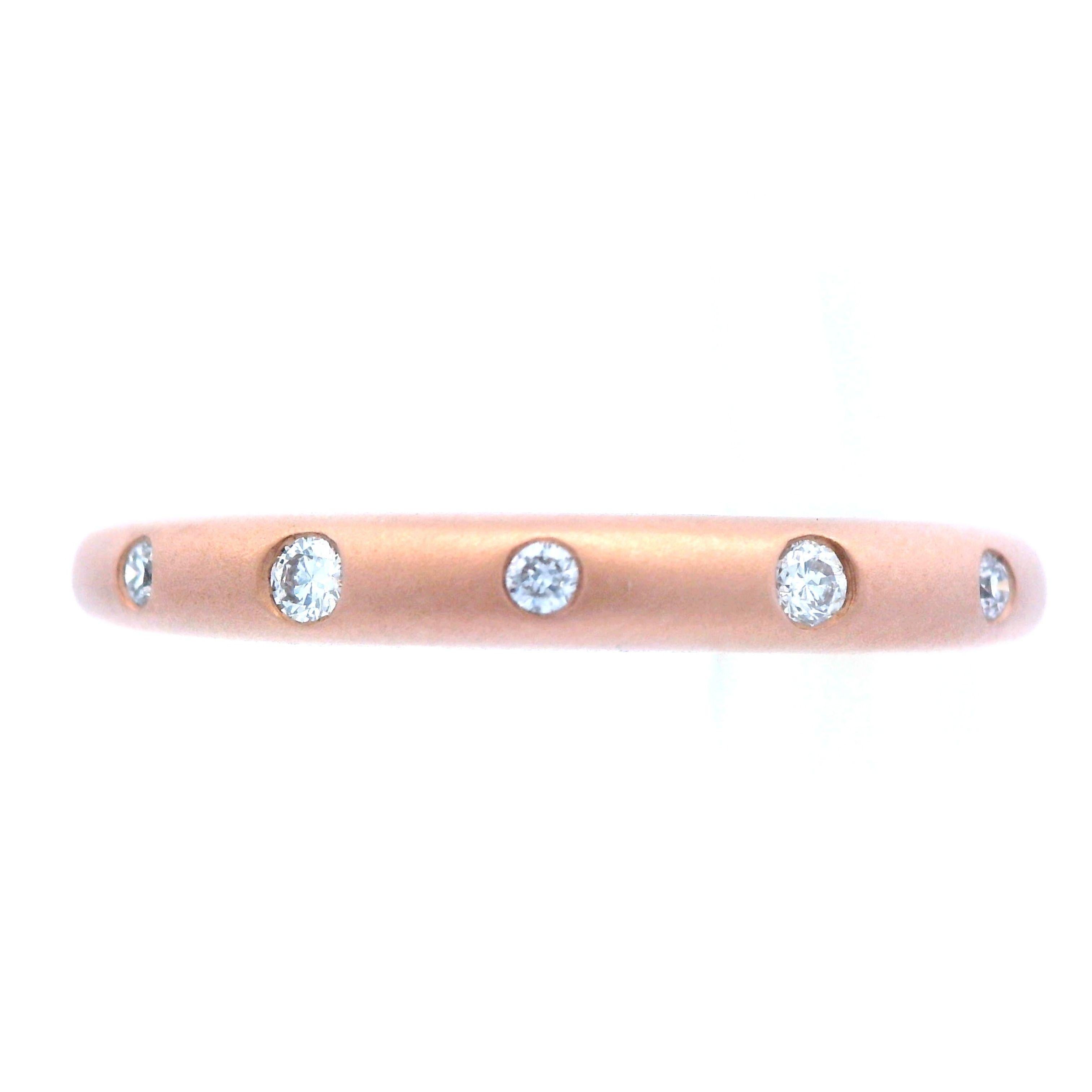 This beautiful band is made by the renowned designer Allison Kaufman using 14k rose gold and diamond. This band features a half band design in which half of the 14k rose gold ring is a matte finish and the other half is a high polish finish. This
