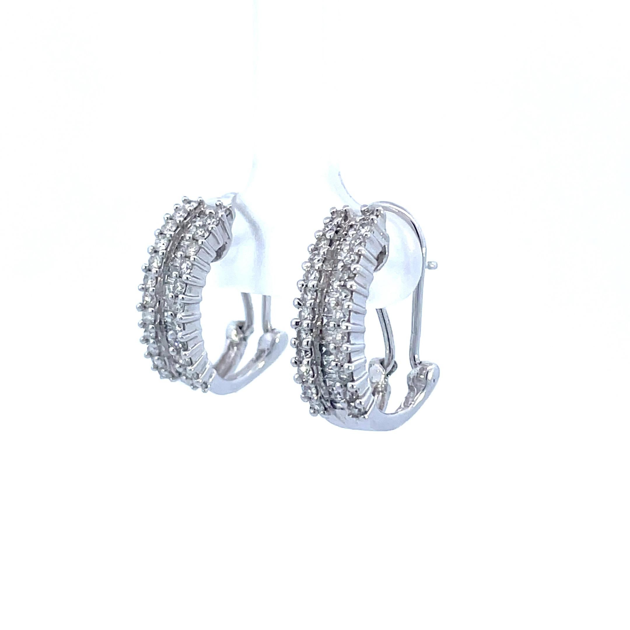- 14K White Gold 
- 1.00 cttw G color VS2 clarity diamonds 
- Round/baguette cut diamonds 
- Omega Back Post 
- 9.64 grams 

This is a stunning pair of contemporary earrings made in 14k white gold with baguette and round cut diamonds, featuring