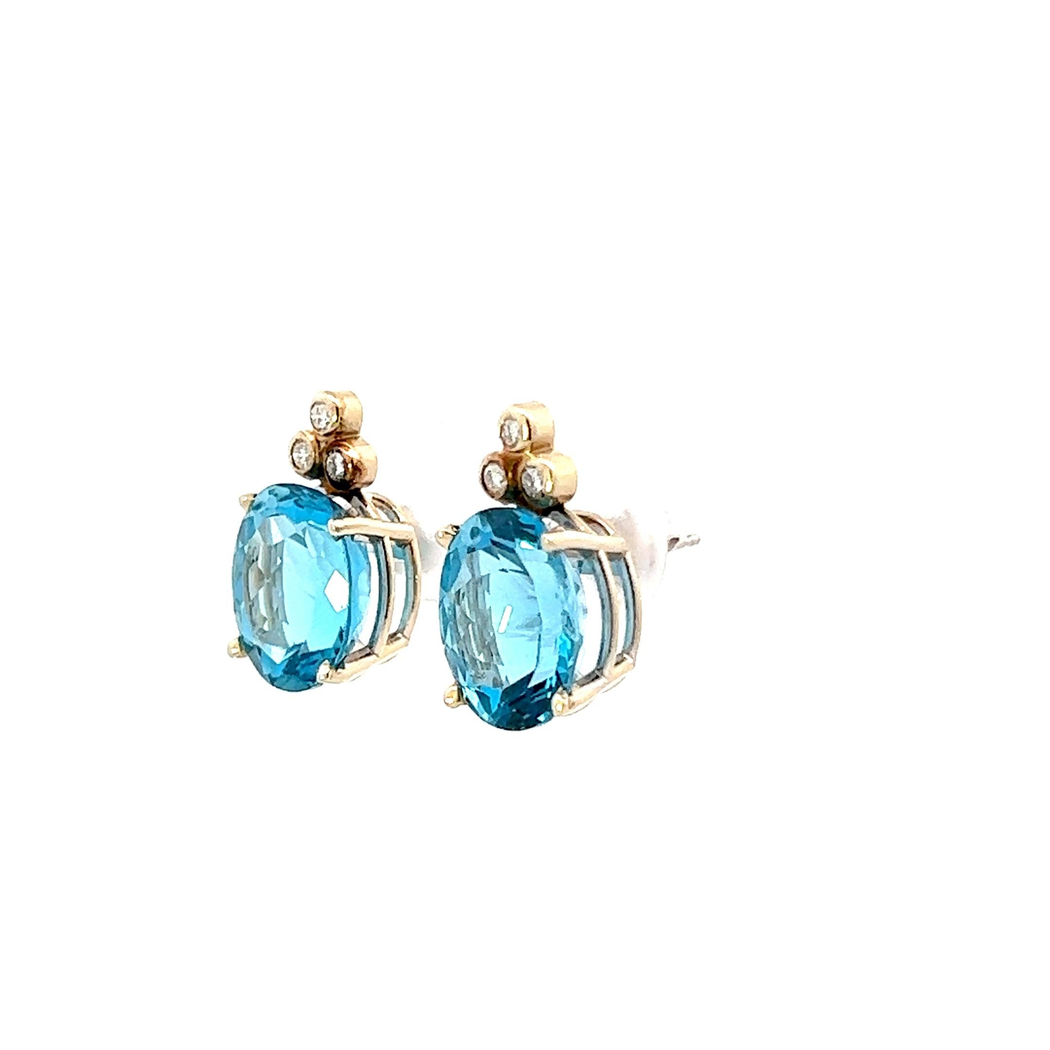 Oval Cut Contemporary 14K White Gold Blue Topaz & Diamond Earrings  For Sale