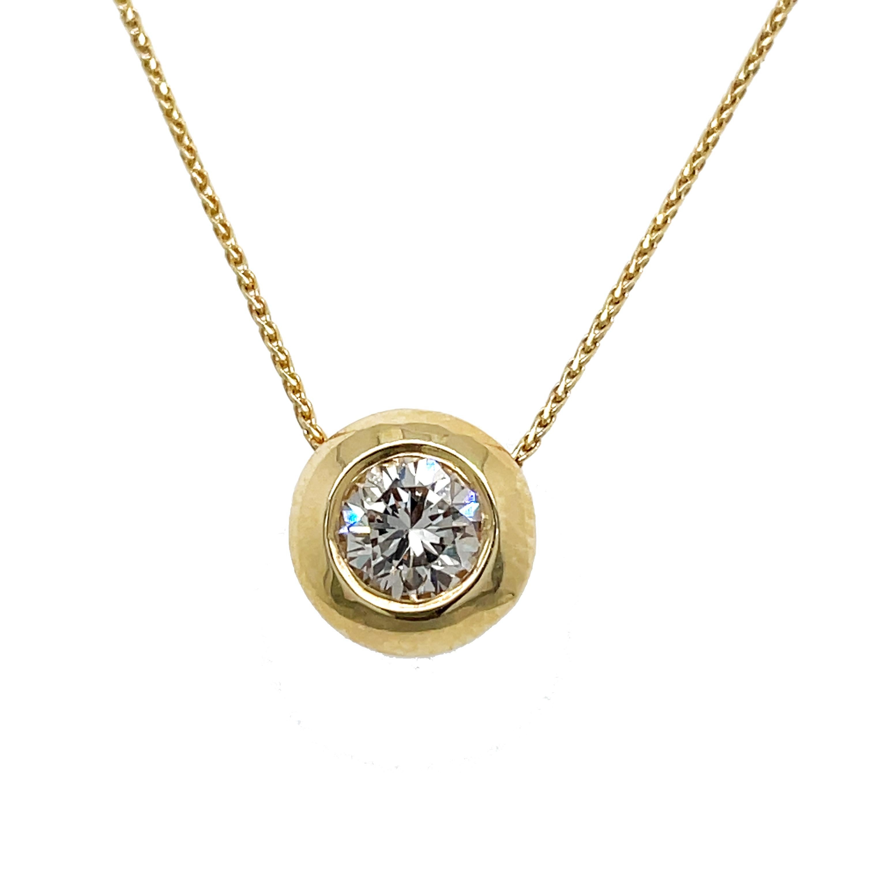 This is a classic 14K yellow gold necklace that features a gorgeous sparkling bezel set diamond floating along the chain. This is the perfect way to celebrate any significant event, transition, or achievement in your life. This lovely necklace is