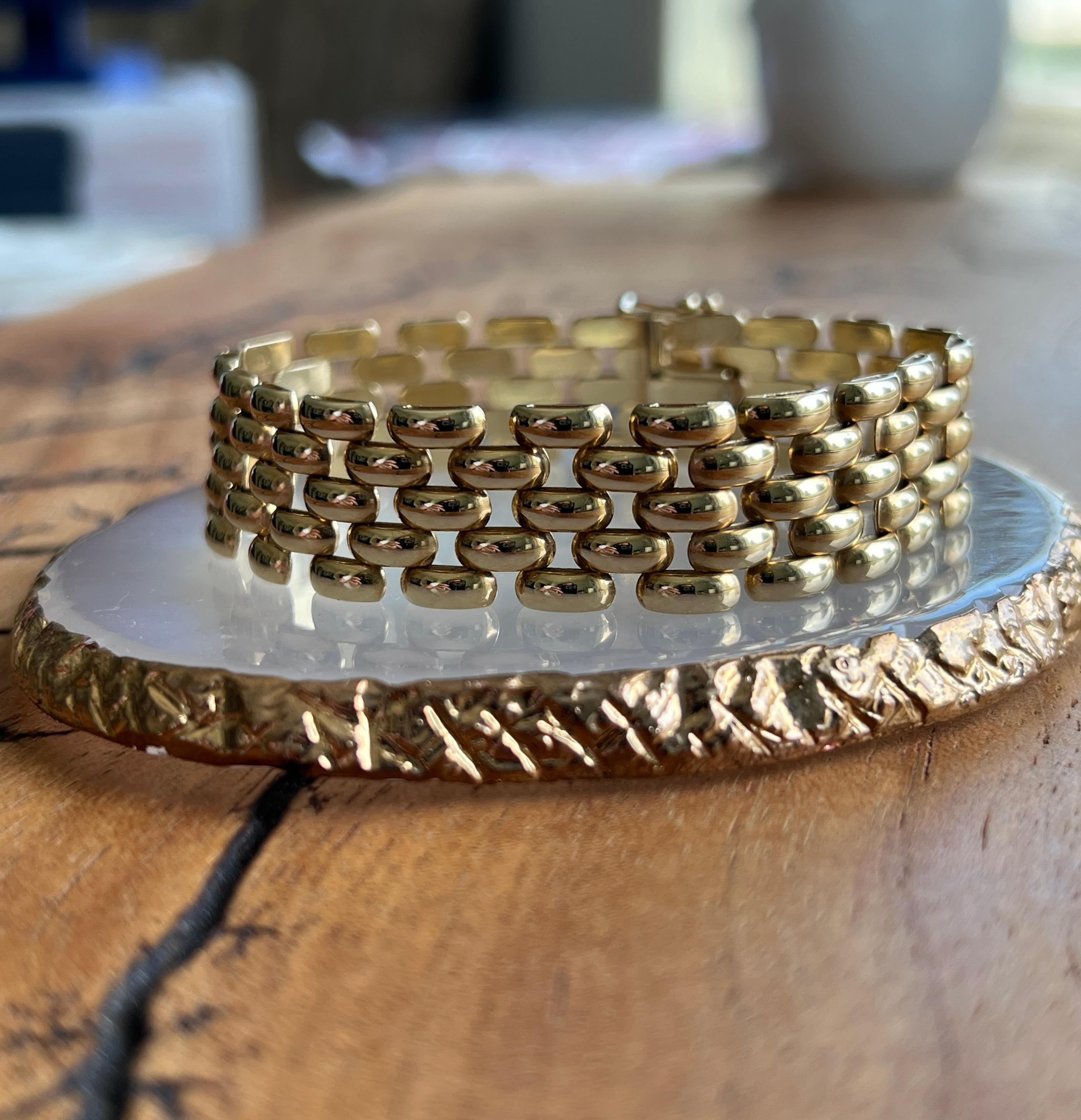 This contemporary 14 karat yellow gold brick/panther link bracelet is a timeless statement of modern elegance. Expertly crafted with a sleek, structured design, it features a hidden box clasp secured with a figure-eight safety for added peace of