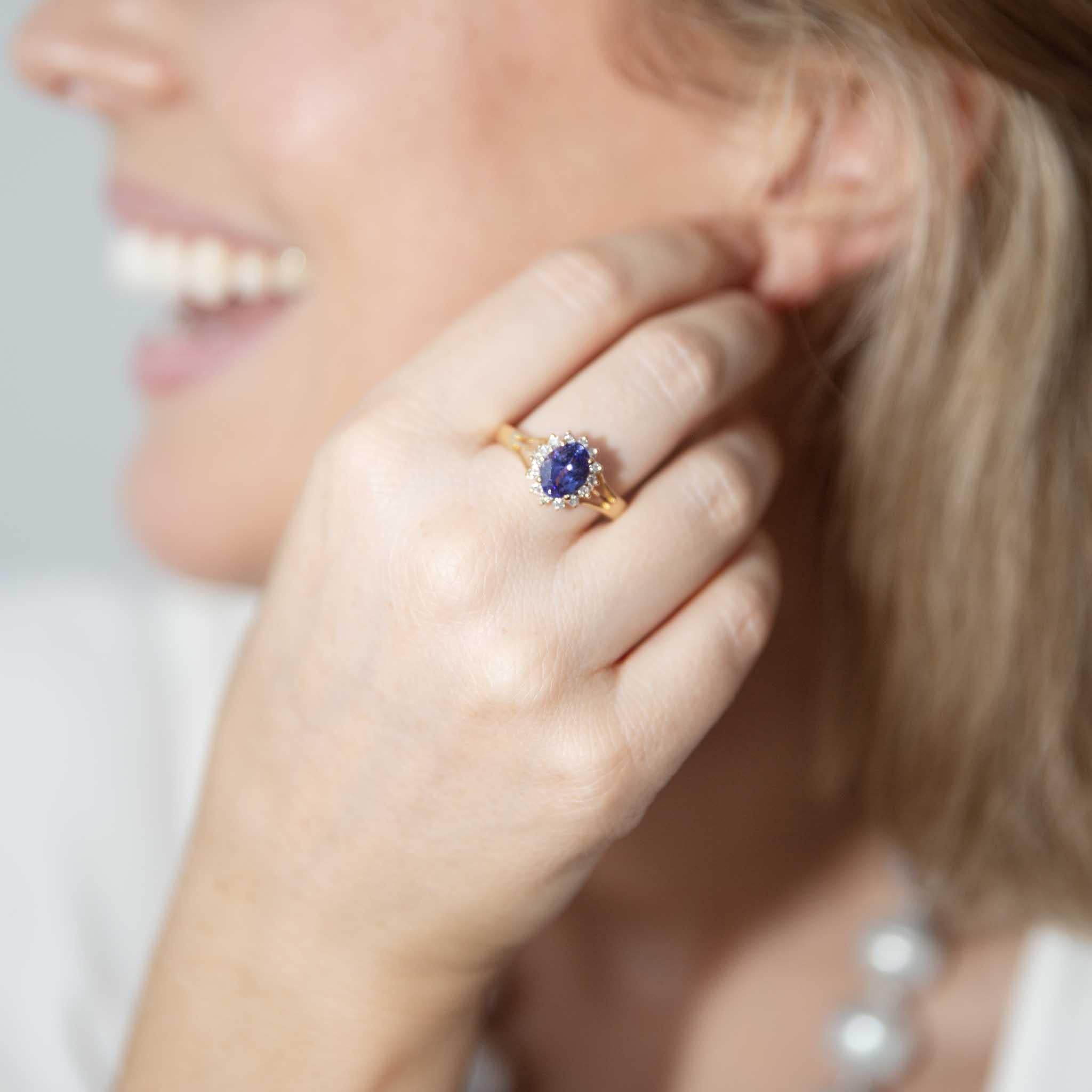 Crafted in 18 carat gold, our Aloy Ring with her royal purple-blue tanzanite set in a halo of shimmering diamonds, is a timeless classic. She is a beautiful way to make promises your heart will keep for generations.

The Aloy Ring Gem Details
The
