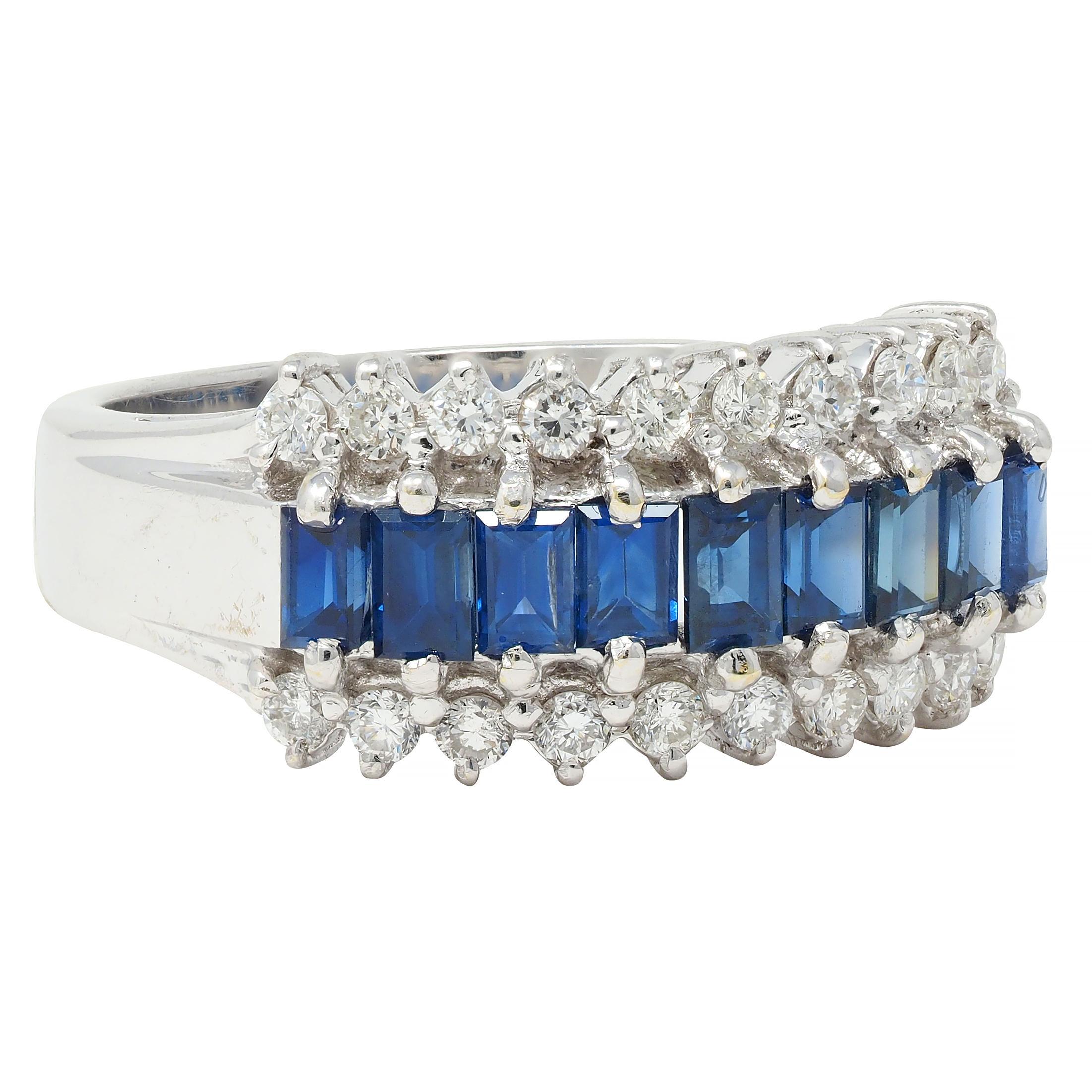 Featuring a row of baguette cut sapphires weighing approximately 0.99 carat total 
Transparent medium blue and prong set east to west 
Flanked by rows of round brilliant cut diamonds
Weighing approximately 0.60 carat total 
G/H color with VS2