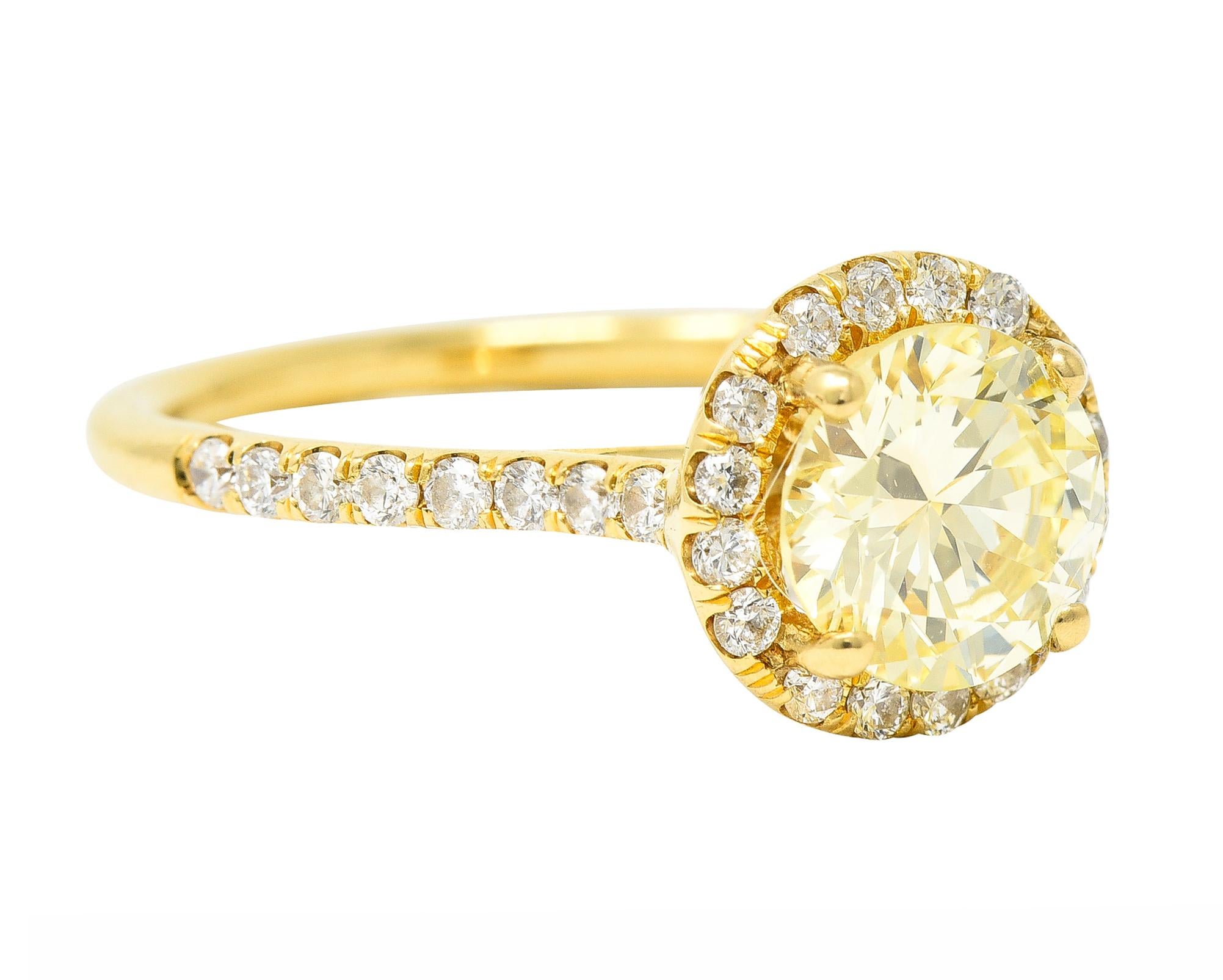 Brilliant Cut Contemporary 1.65 Carats Fancy Light Yellow Diamond 18 Karat Gold Halo Ring For Sale