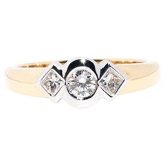 Retro Contemporary 18 Carat Yellow White Gold Rub Over Set Diamond Three Stone Ring