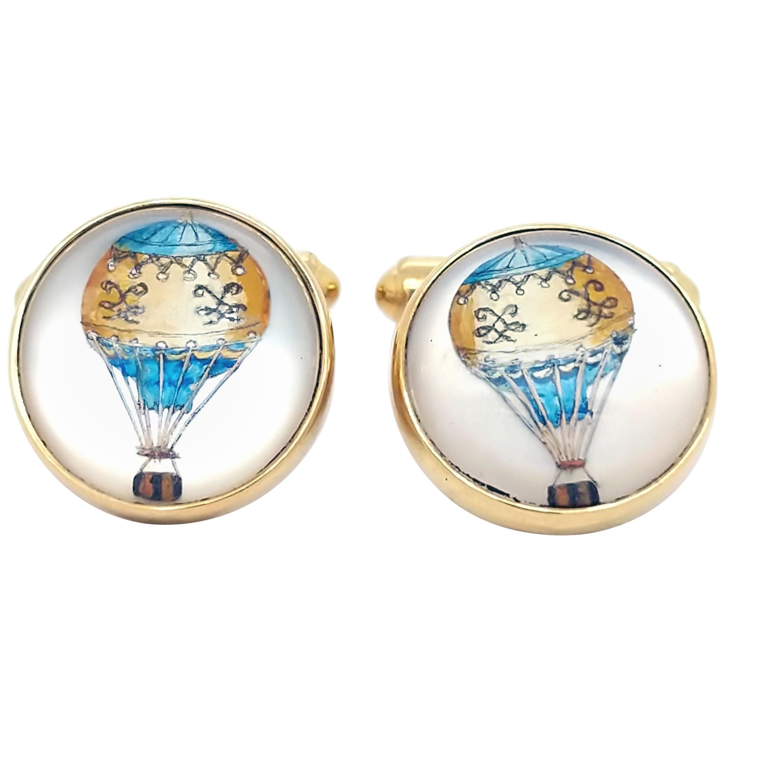 These cufflinks are adorable! Made of 18K yellow gold and hand-painted crystal, these cufflinks are sure to bring you handfuls of compliments! The hot air balloon in these cufflinks are lovely shades of yellow and blue, and they are sure to excite