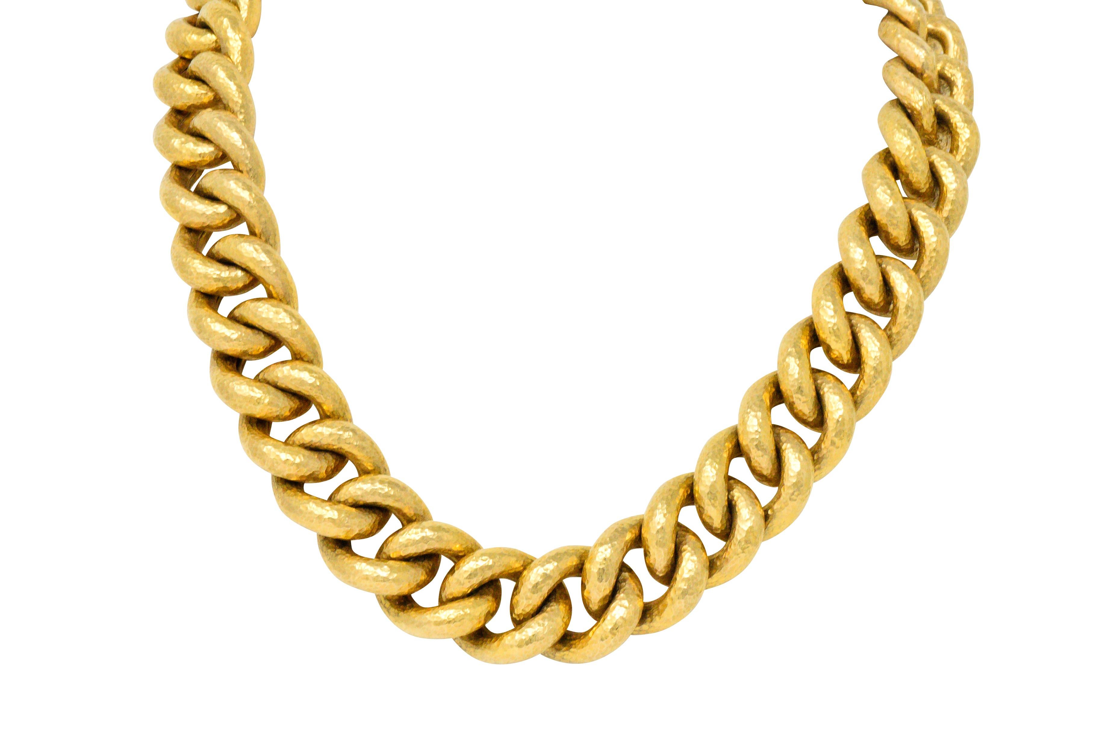 Hammered solid gold curb links

Concealed clasp with double figure-eight safety and maker's mark

Rich gold with a wonderful solid feel

Length: 18 Inches

Width: 3/4 Inch

Total Weight: 1989 Grams 

Mod. Lush. Glowing. 

We- 1443