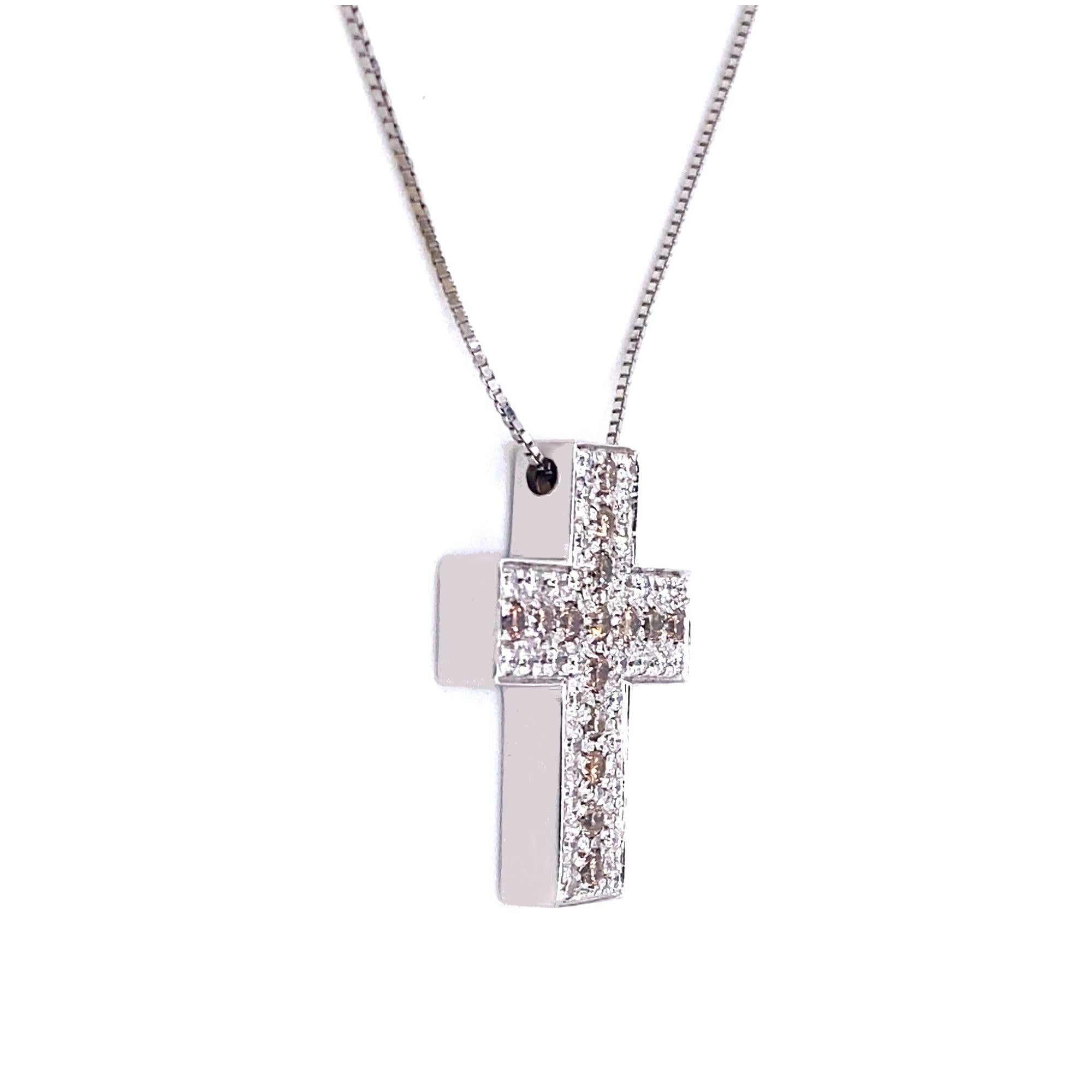 A beautiful contemporary cross with .7-carats of diamonds (F/G VVS) set in 18-karat white gold. The chain is a delicate 18-karat white gold. The pendant measures 1.9-centimetres across, and 2.3-centimetres long. 

Are you looking for a set? Our