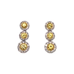 Contemporary 18 Karat White Gold Fancy Yellow Diamond Graduating Drop Earrings