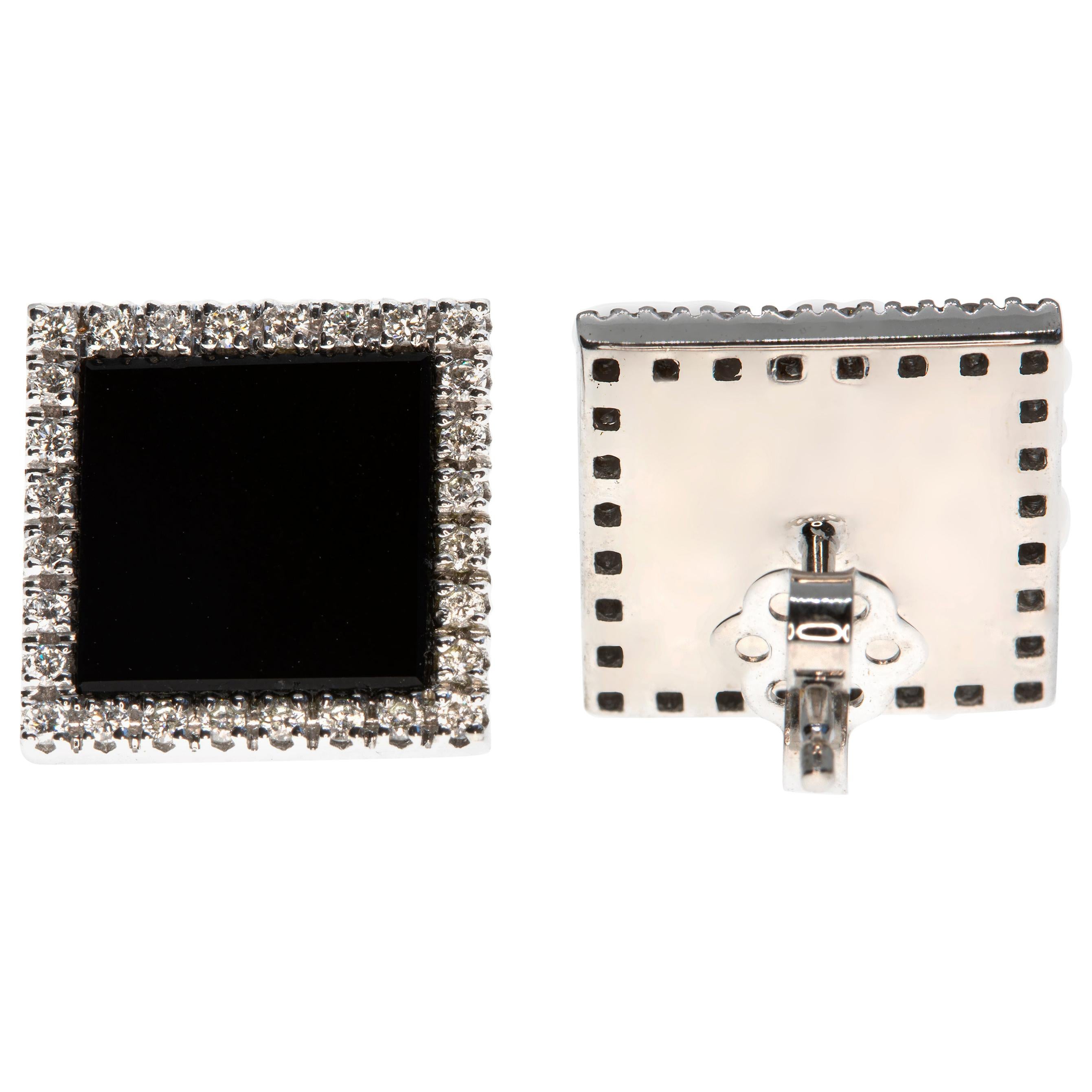 These square onyx earrings, masterfully created by hand from 18-karat white gold, are set with a border of brilliant white diamonds.

This is a delightful pair of earrings with post and butterfly backs. They measure 13 millimetres across. 

Looking
