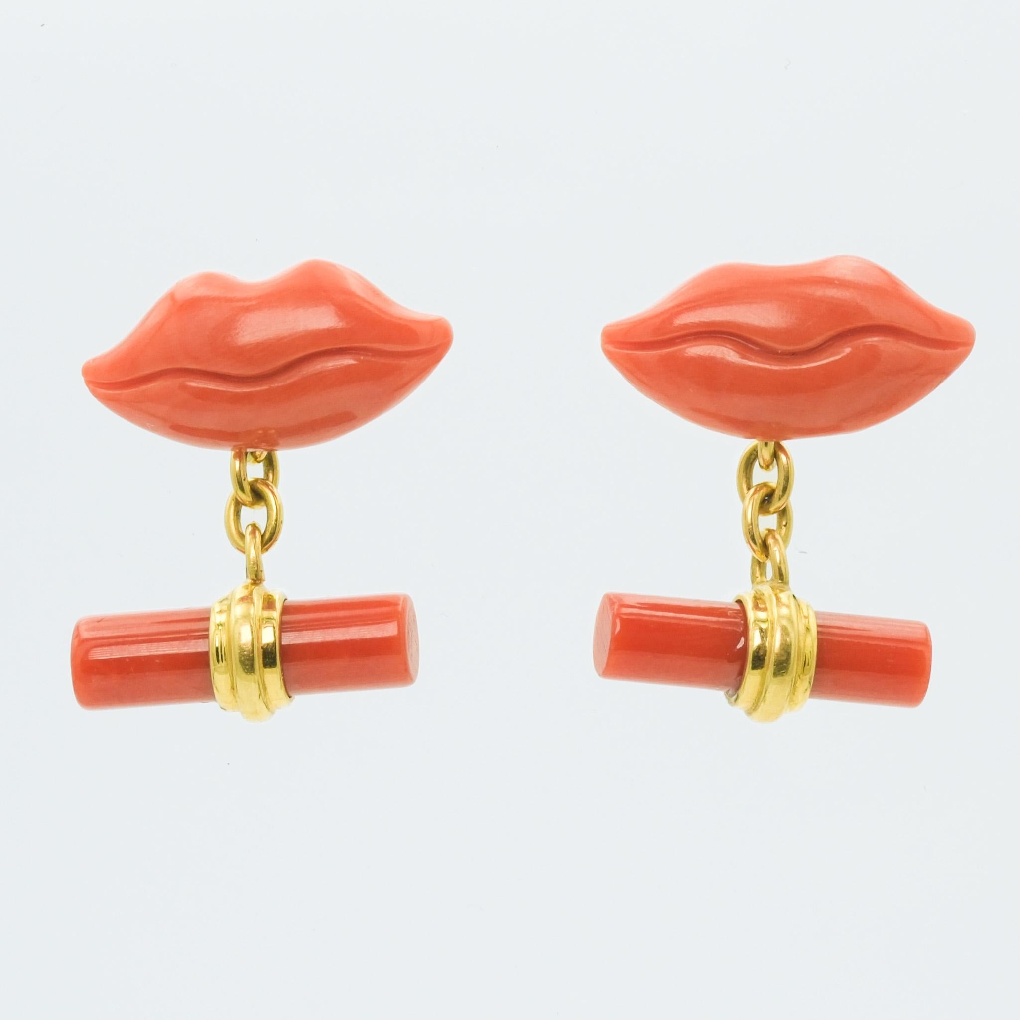 These contemporary coral lip cufflinks offer an eye-catching blend of whimsy and elegance, crafted in 14 karat yellow gold. The vibrant pink, salmon coral strike a bold contrast against the rich gold, make these funky cufflinks a distinct accessory