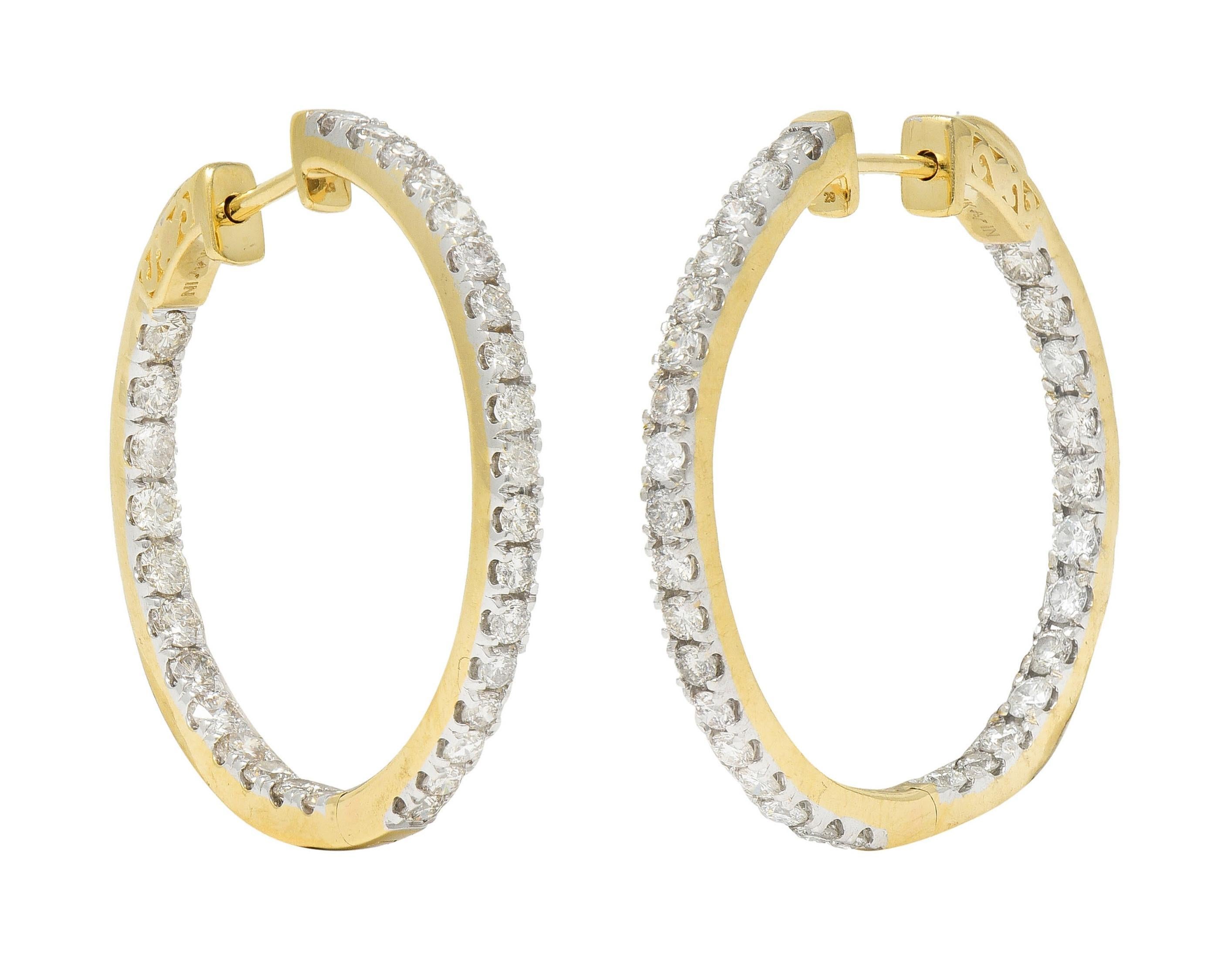 Designed as round hoops featuring round brilliant cut diamonds inside-outside style
Weighing approximately 1.80 carats total - G/H color with VS1 clarity
Set with white gold prongs
Hoops open on a hinge
Completed by notched posts
Stamped 14 karat
