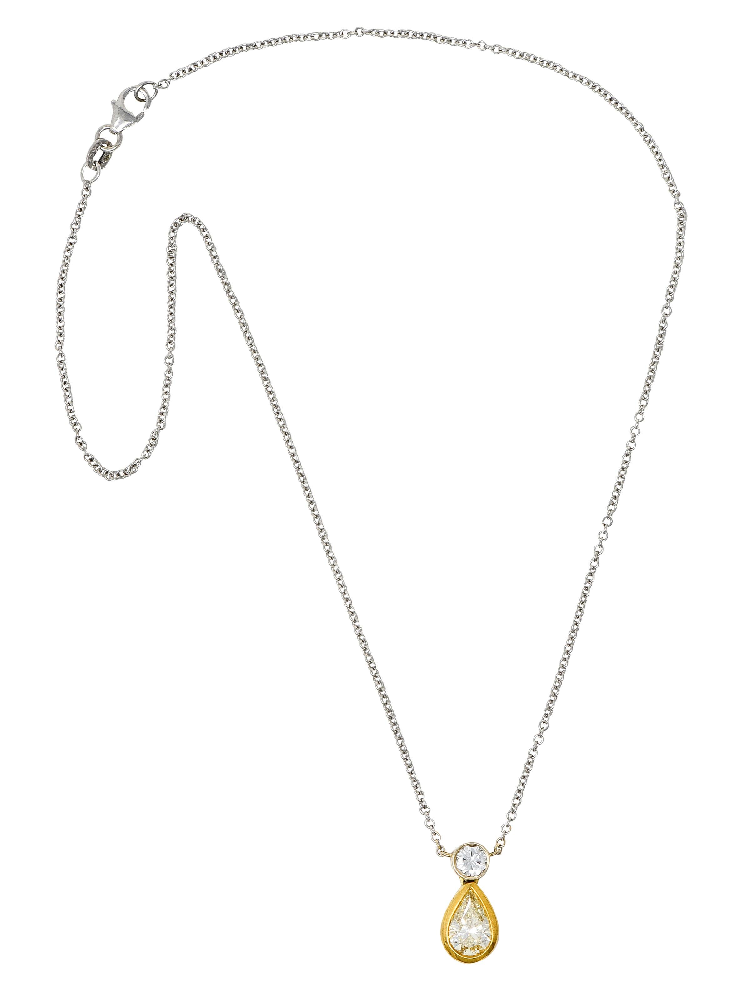 Cable chain necklace centers a fixed diamond drop station. Surmount is a round brilliant cut diamond set in white gold. Weighing approximately 0.40 carat with H color and SI2 clarity. With an articulated drop featuring a pear cut light fancy yellow