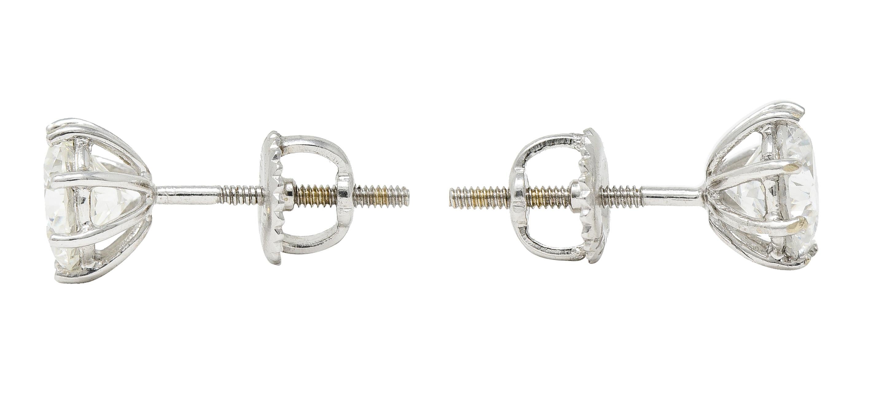Stud earrings feature round brilliant cut diamonds - very well matched. One weighing approximately 0.92 carat with G color and VS2 clarity. Other weighs approximately 0.94 carat with H color and VS2 clarity. Securely set via eight prongs with a