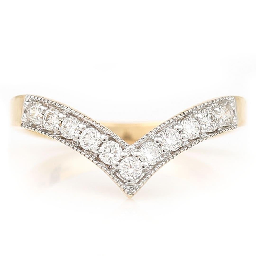 A beautifully handcrafted love token this 18ct gold and brilliant cut diamond ring symbolising good wishes and luck for the future, the wishbone ring exudes sparkle and charm from every diamond facet. With a total of 11 E-F colour brilliant cut