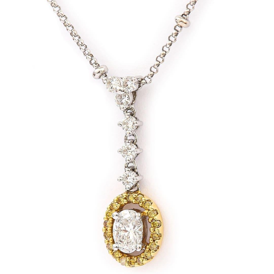 A beautiful contemporary 18ct gold white and yellow diamond halo pendant on a fine 18ct white gold beaded, belcher necklace. A very elegant piece, the diamonds estimated 0.82ct shine brightly with an eye catching scintillation. Extra detail has been