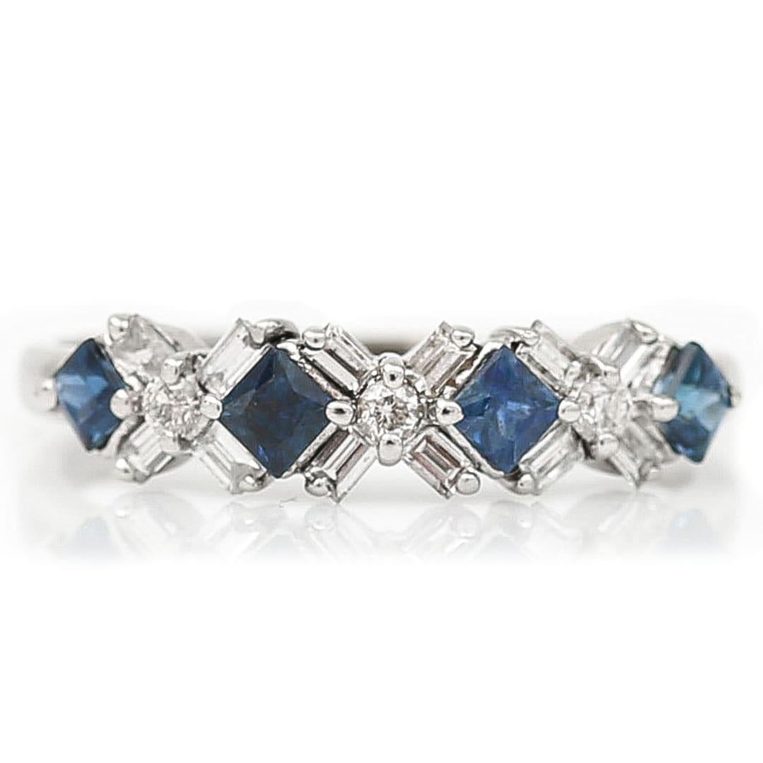 A super stylish, contemporary 18ct white gold half eternity ring formed of sapphire and diamonds in the most unique geometric pattern. The ring dating from the 21st century is formed of 4 square cut deep, blue sapphires of 0.80ct  bordered by