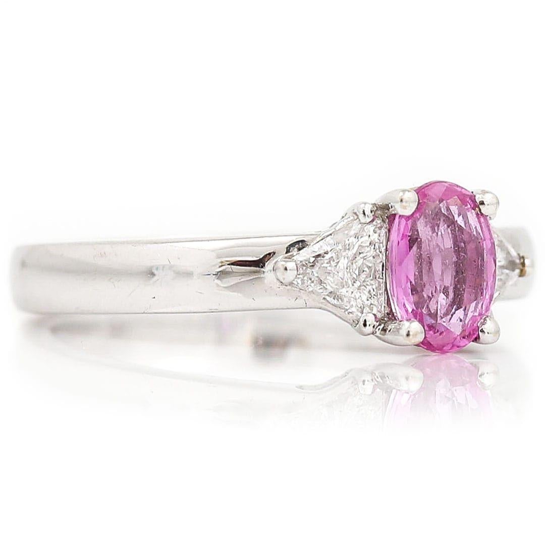 Oval Cut Contemporary 18ct White Gold Pink Sapphire and Trillion Cut Diamond Trilogy Ring For Sale