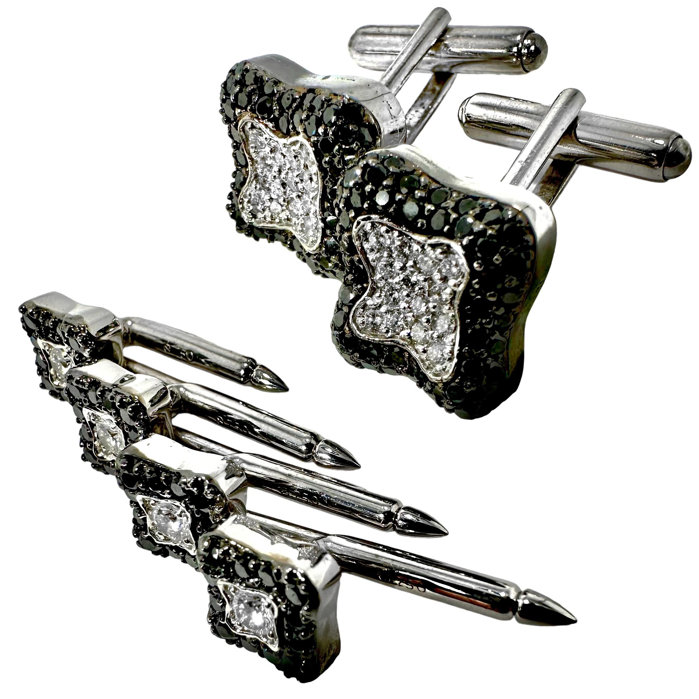 This artistically designed 18k white gold modern dress set by designer Mecan consists of cuff links with four matching stud buttons, generously set with brilliant cut white diamonds at the center surrounded by glistening black diamonds. The