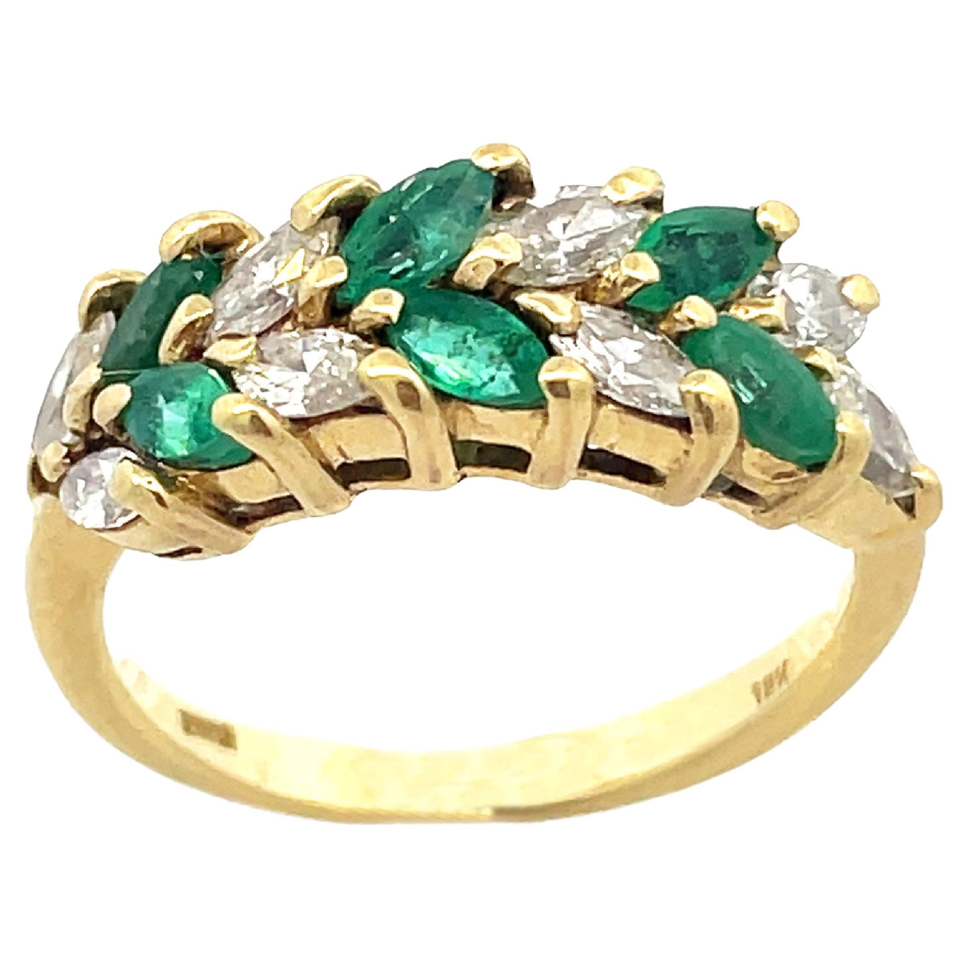 This is a breathtaking ring crafted in beaming 18K yellow gold that showcases a beautiful and sparkling duo of vivid green marquise emeralds and diamonds. With this nature-inspired ring, you can pique her attraction to the great outdoors. This