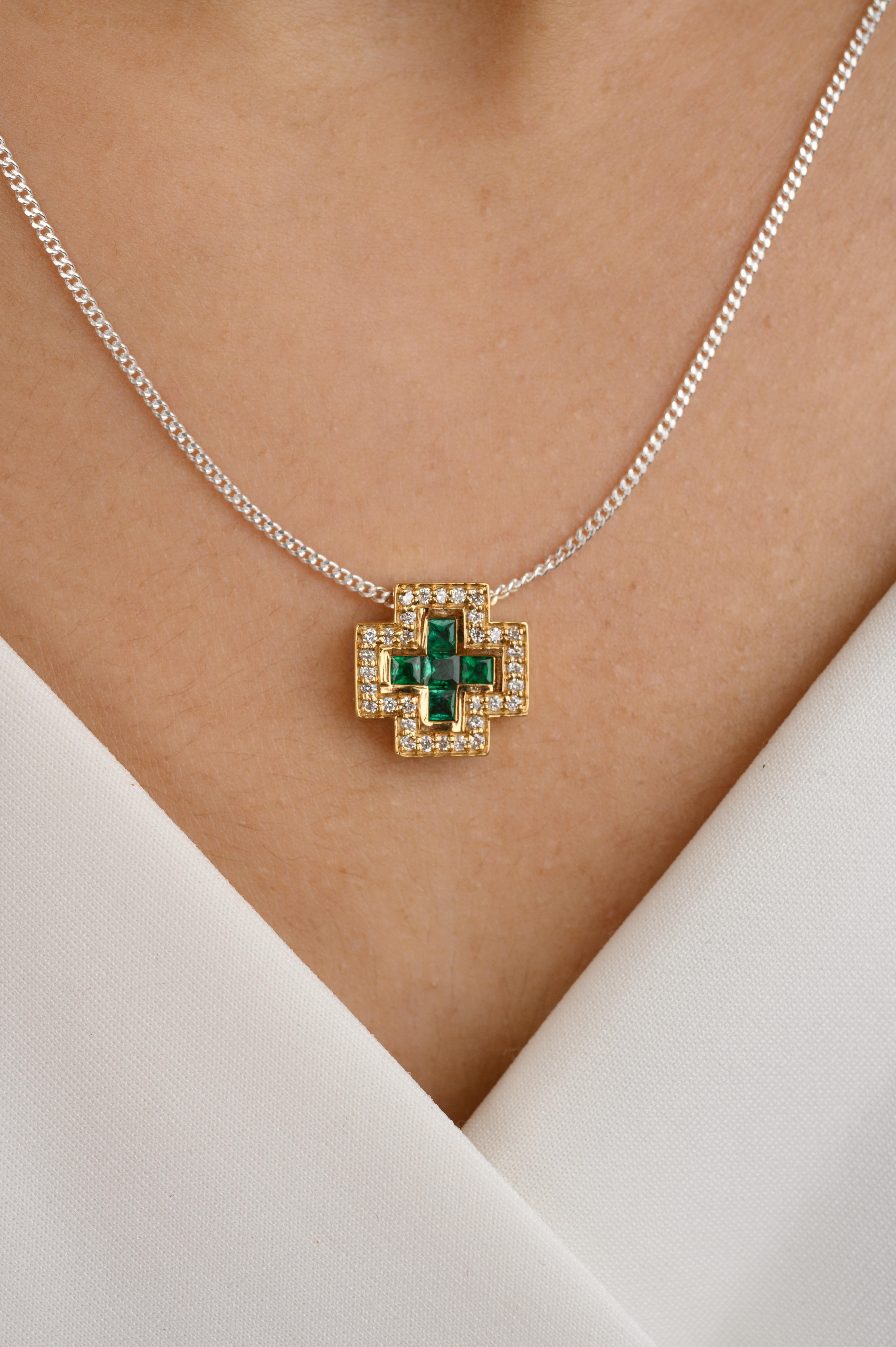 Art Deco Natural Emerald Diamond Bold Cross Pendant in 18K Gold studded with square cut emeralds. This stunning piece of jewelry instantly elevates a casual look or dressy outfit. 
Emerald enhances the intellectual capacity of the person.
Designed