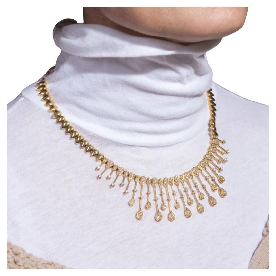 This contemporary necklace is a true statement piece, meticulously crafted in 18K yellow gold and adorned with a dazzling array of 209 diamonds. Each of the diamonds is carefully set to enhance the brilliance and allure of the necklace, creating a