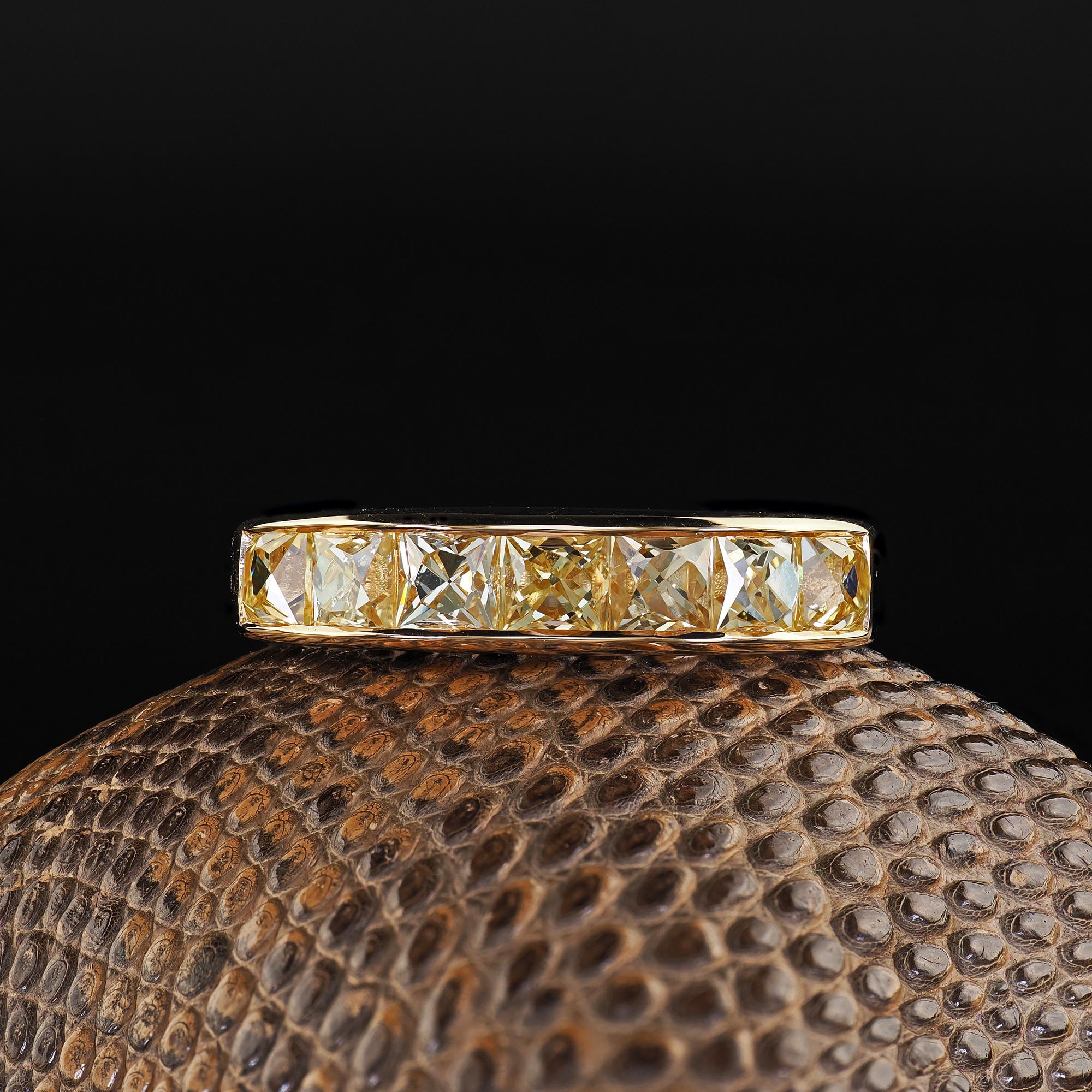 Beautiful Contemporary 18K Yellow Gold Reclaimed Yellow French Cut Diamond Wedding Band. This incredible contemporary fancy yellow French cut diamond wedding band is crafted in 18k yellow gold. This amazing ring features old fancy yellow French cut