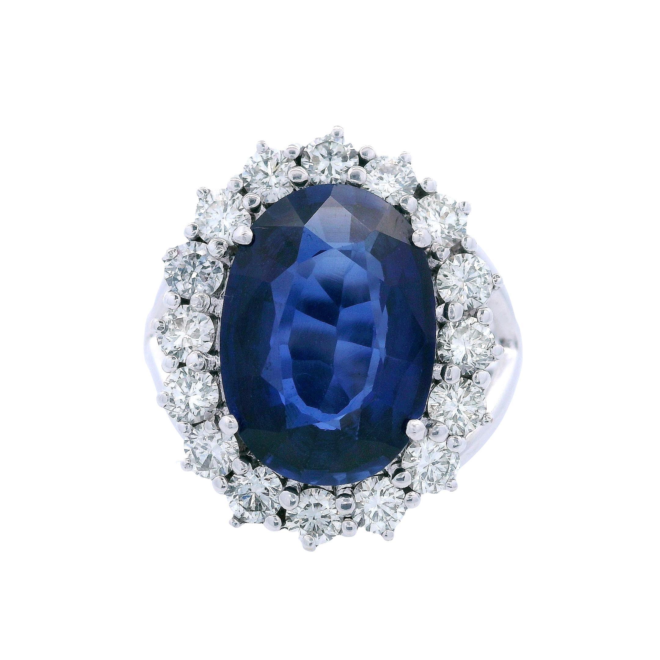 Contemporary 18kt white Gold Halo Ring with Diamonds and synthetic Sapphire