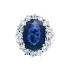 Contemporary 18kt white Gold Halo Ring with Diamonds and synthetic Sapphire