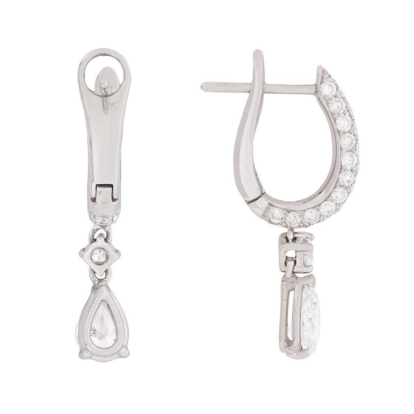 These stunning earrings feature pear-shaped diamonds which steal the show! Each main diamond has it’s own GIA certificate, stating that one is 0.56 carat and the partner is 0.57 carat – totalling 1.13 carat. They are graded as G in colour, with one