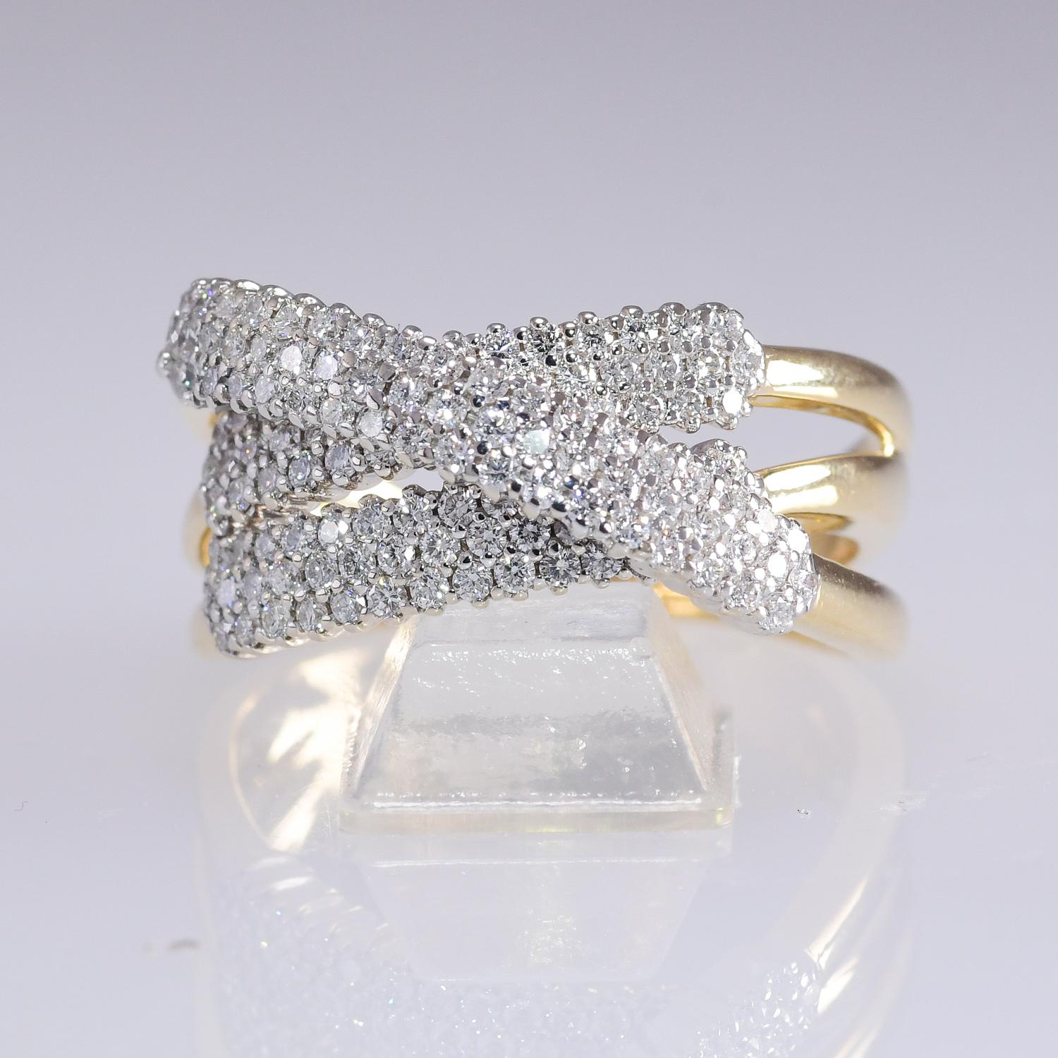 This stunning elegant Italian designed ring has three rows of diamonds with three diamonds in each row. The pave' set diamonds total 2.0 carat and are VVS2-VS2; G-H quality. The ring is crafted in 18 karat yellow gold and weighs 12.8 grams. The ring