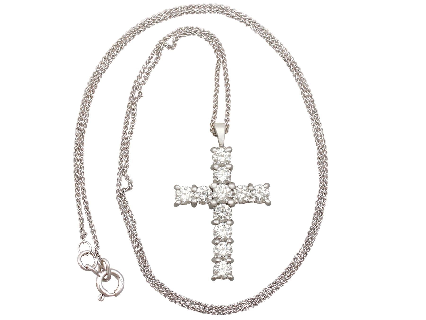 An impressive contemporary 1.65 carat diamond and 18 karat white gold cross pendant and spiga chain; part of our diverse diamond jewelry and estate jewelry collections.

This fine and impressive contemporary diamond pendant has been crafted in 18k