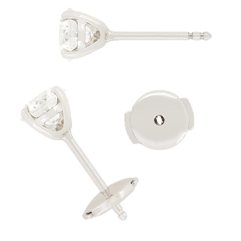 This timeless pair of  stud earrings feature a radiant 1.01 carat round brilliant diamond in each. Both diamonds have been certified I in colour and range in clarity from VS1 to VS2 in clarity. The diamonds are claw set in a ‘V’ shaped stud mount