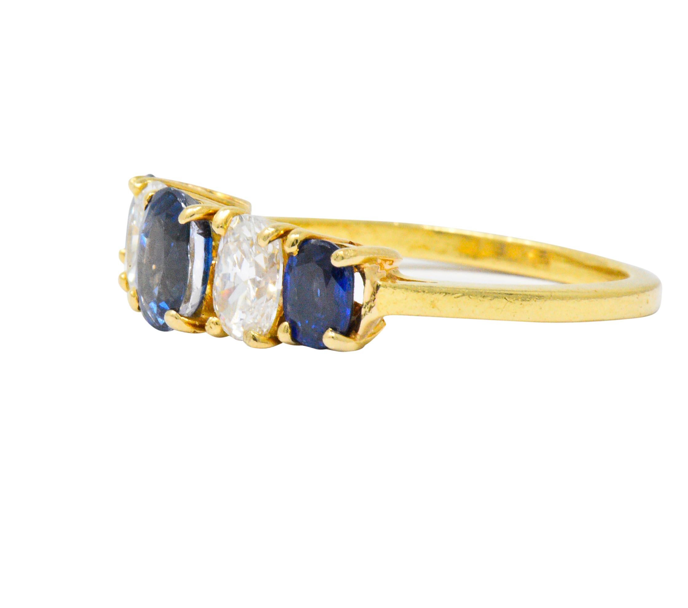 Five stone band ring designed with oval cut sapphire alternating with oval cut diamonds, prong set to front

Three sapphires weigh in total approximately 1.30 carats, a very well-matched royal blue

With two diamonds weighing in total approximately