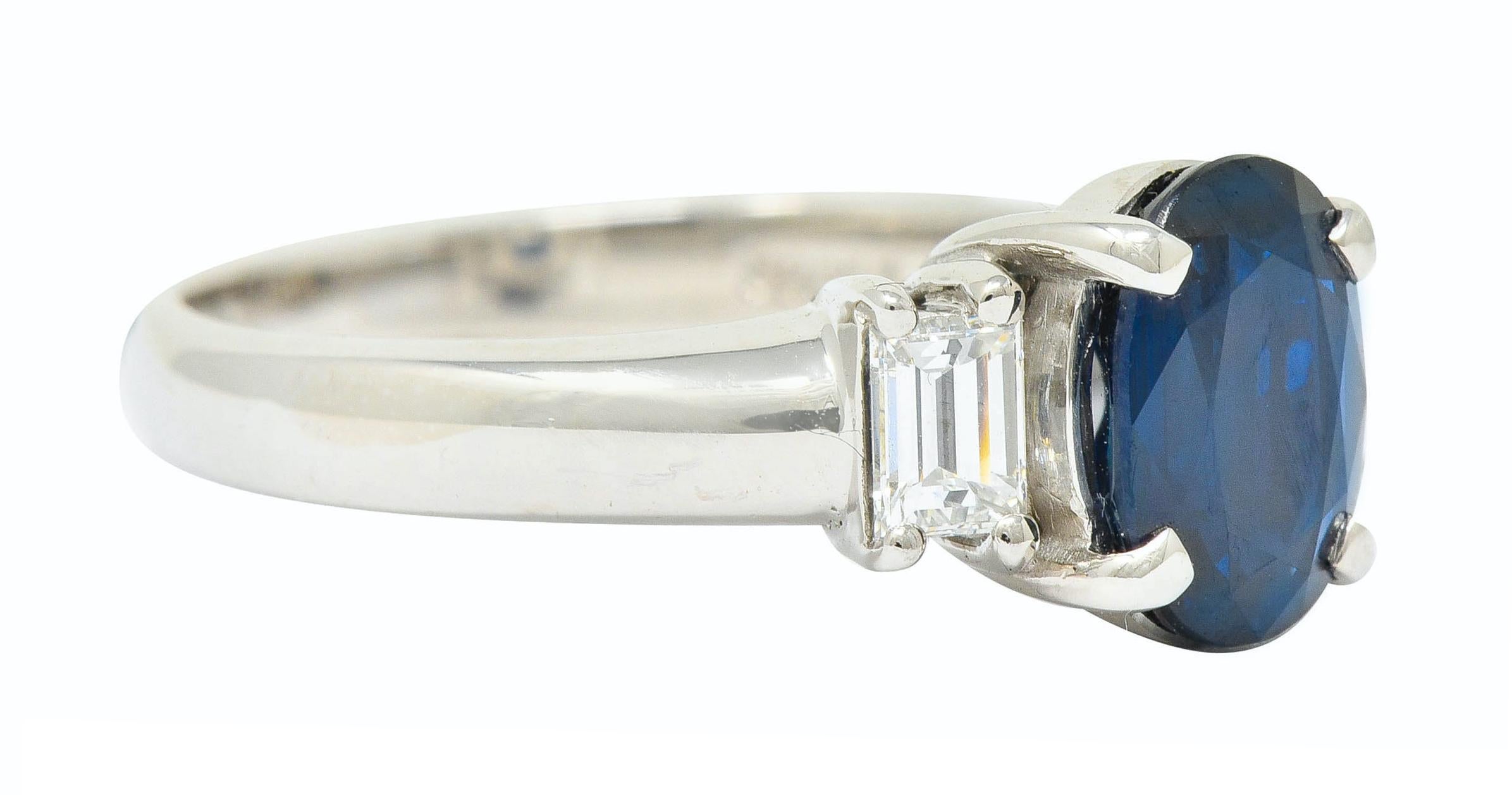 Centering an oval cut sapphire weighing 1.70 carat, transparent with dark blue color

Uniquely basket set and flanked by two baguette cut diamonds weighing 0.38 carat; G/H color with VS clarity

Stamped Pt900 for platinum

Stamped with stone