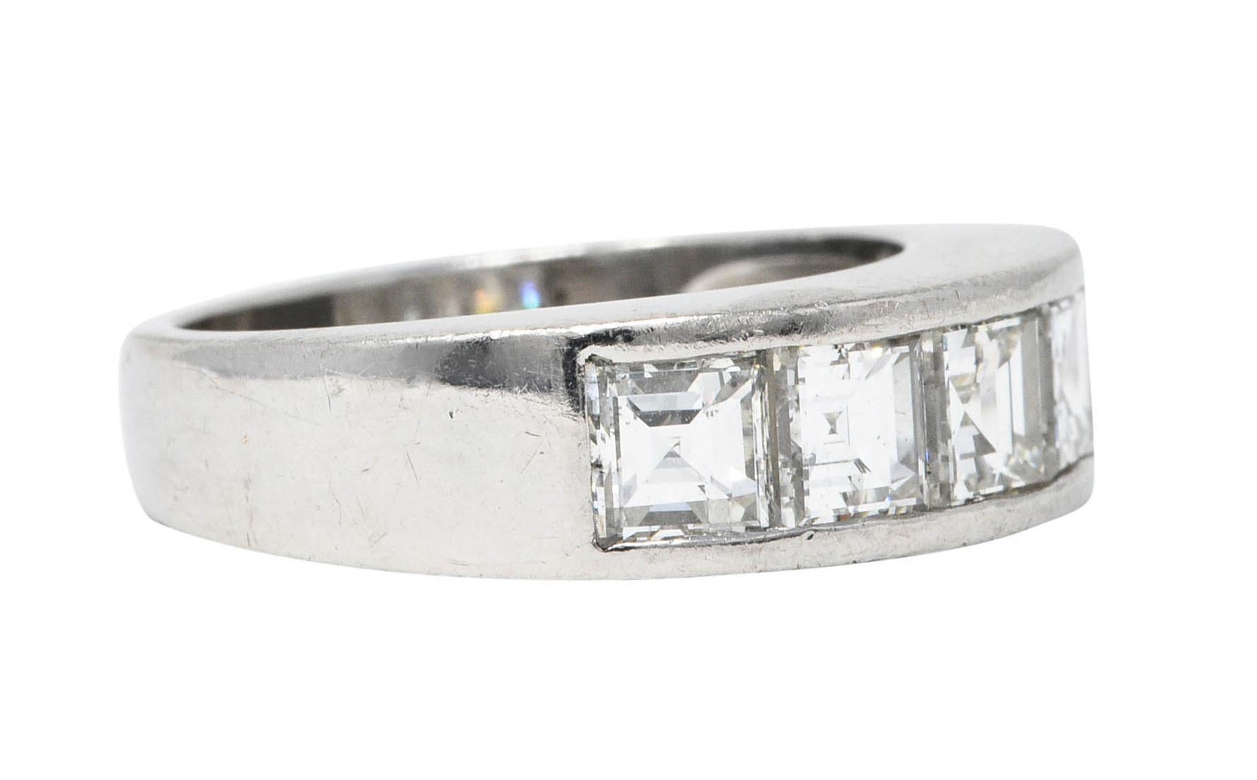 Band ring is channel set to front by five square step cut diamonds

Weighing in total 2.09 carats with bright G/H color and SI to VS clarity

Stamped Pt900 for platinum

Circa: 2000s

Inscribed with carat weight

Ring Size: 5 & sizable up

Measures