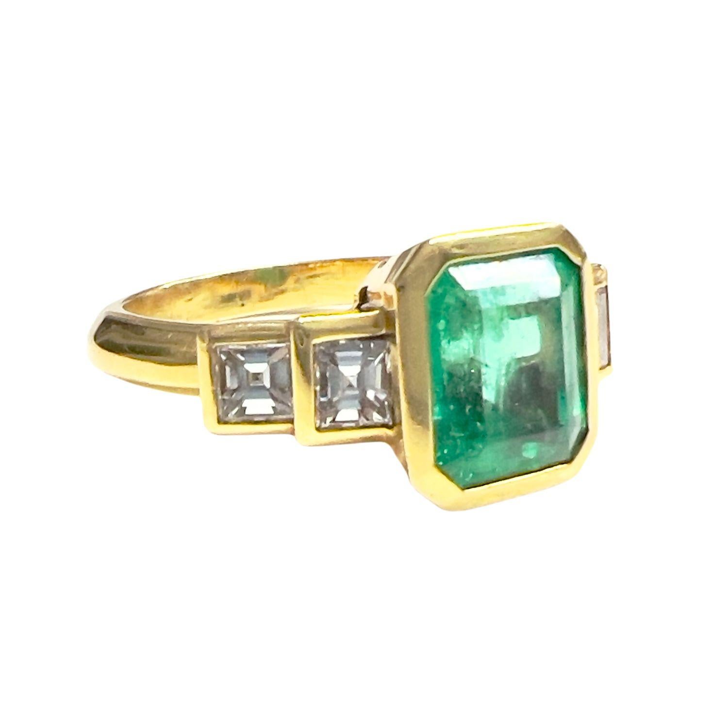 Contemporary 20th Century 18k yellow gold ring with emerald center and diamonds.
Weight: 7.40 grams 
Size: 14/54 (resizable)
Gemological description:
•	Emerald center with emerald cut, weighing 2.50 ct / Triple A purity Emerald. Origin: