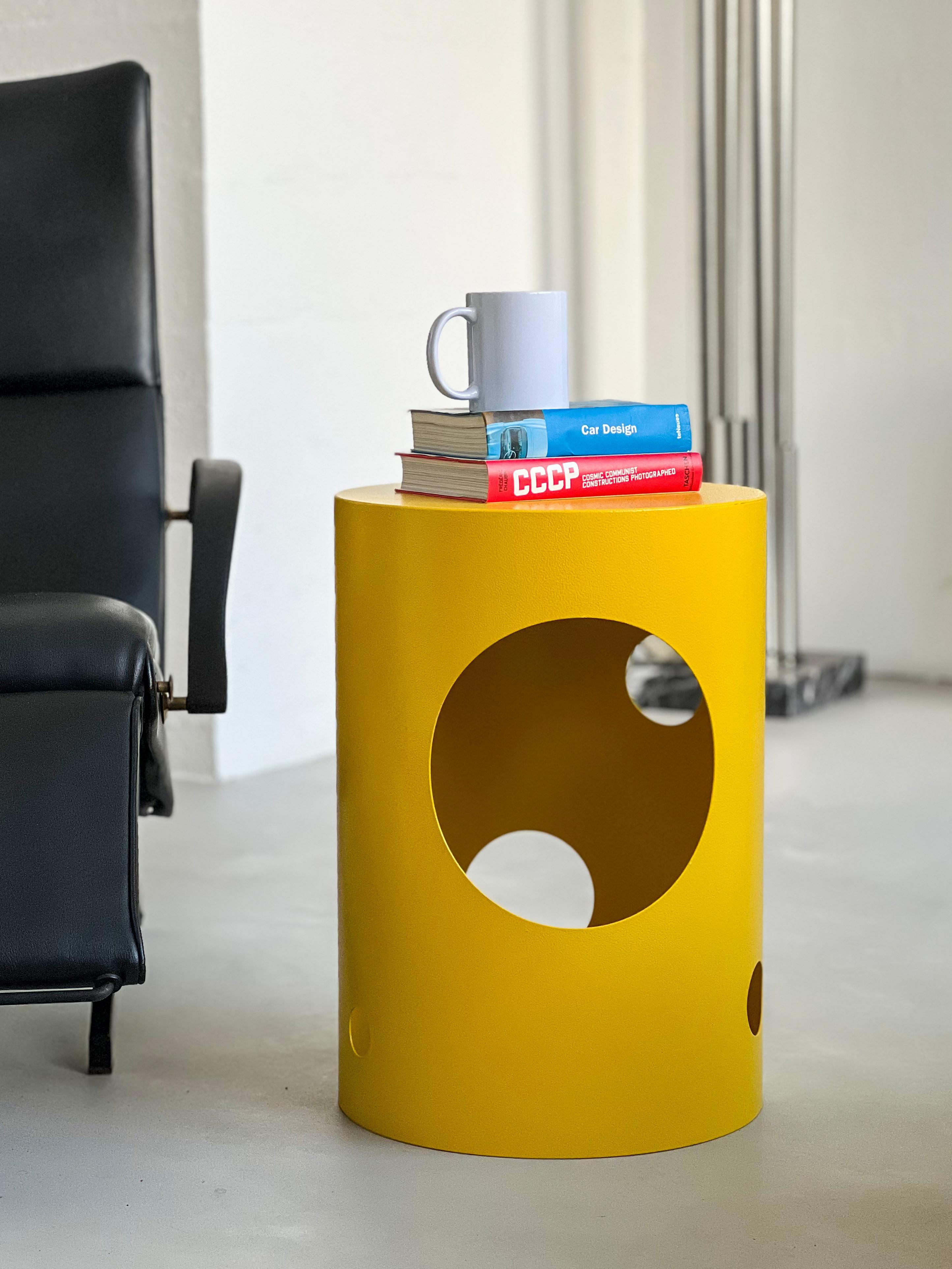 Contemporary 21st Century Metal Stool from the Silös collection by Spinzi. Perfect as a stool or a side/end table, sharp yet pop and ironic in its bright yellow color, the piece is finished in a very resistant and materic 