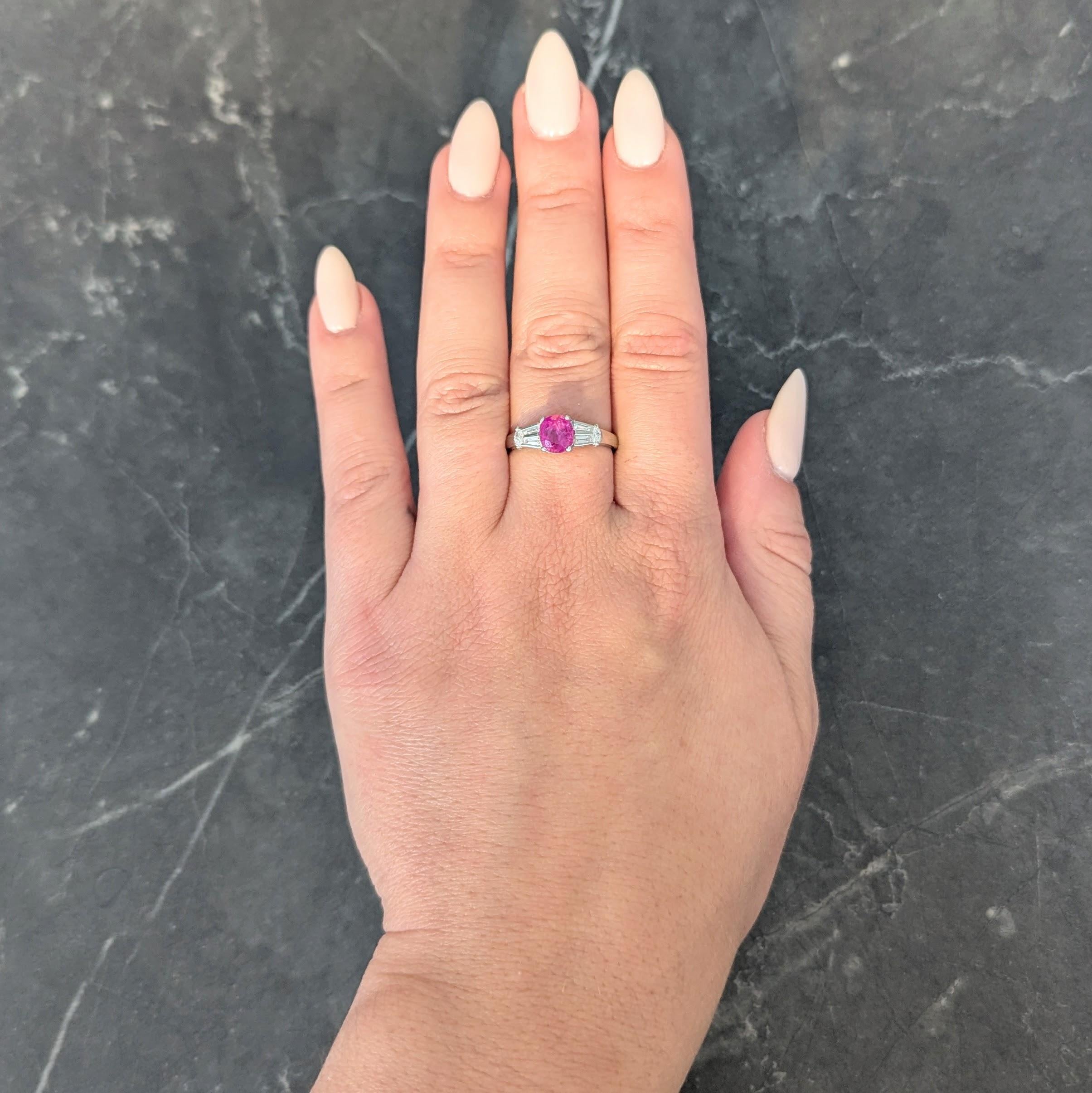Centering an oval cut ruby weighing 1.87 carats total - transparent purple-red in color
Natural Burmese (Myanmar) in origin and displaying no indications of heat treatment
Prong set in basket and flanked by cathedral shoulders bar set with