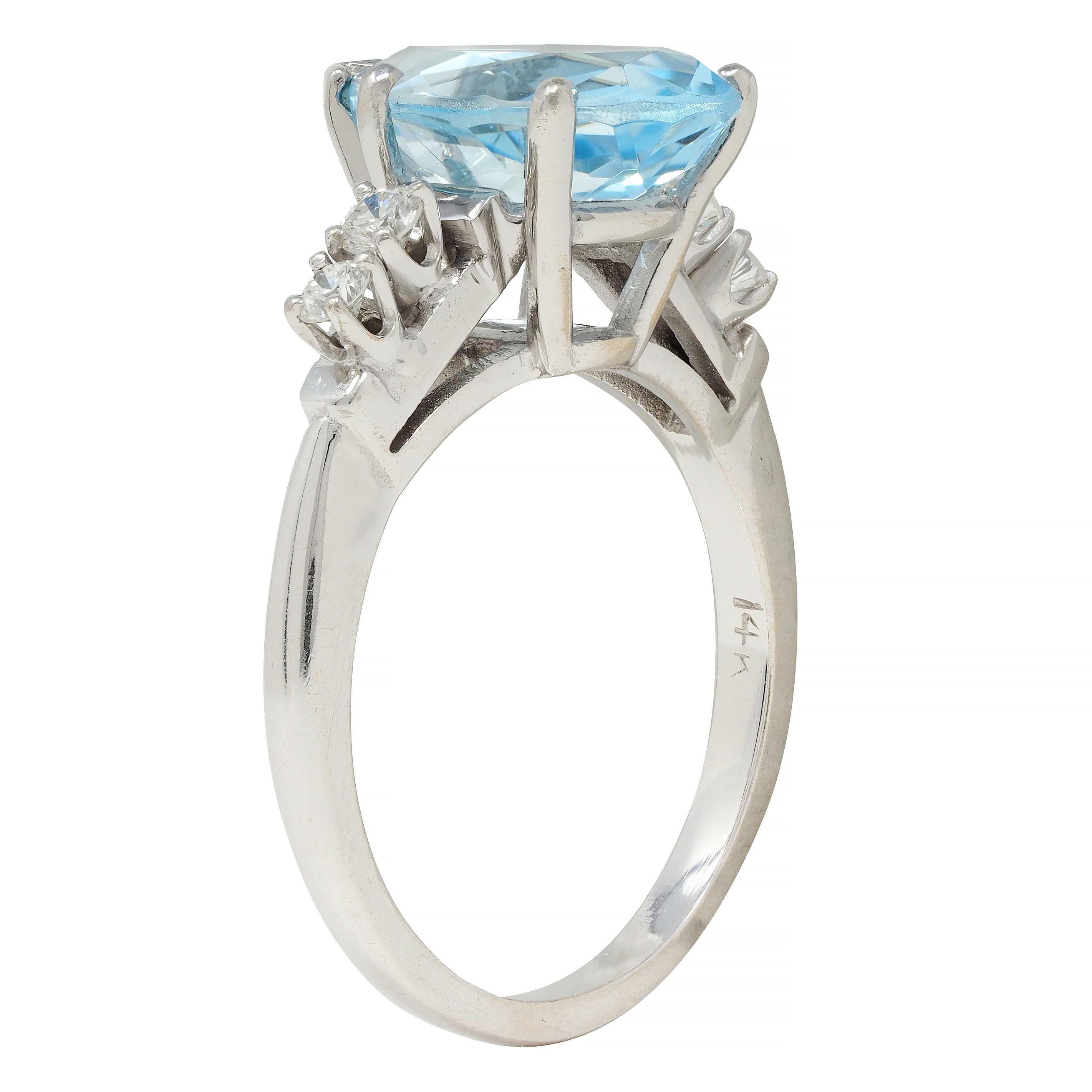 Centering a pear cut aquamarine weighing approximately 2.06 carats - transparent light blue in color 
Prong set in a wire basket and flanked by round brilliant cut diamonds 
Weighing approximately 0.18 carat total - eye clean and bright
Prong set in