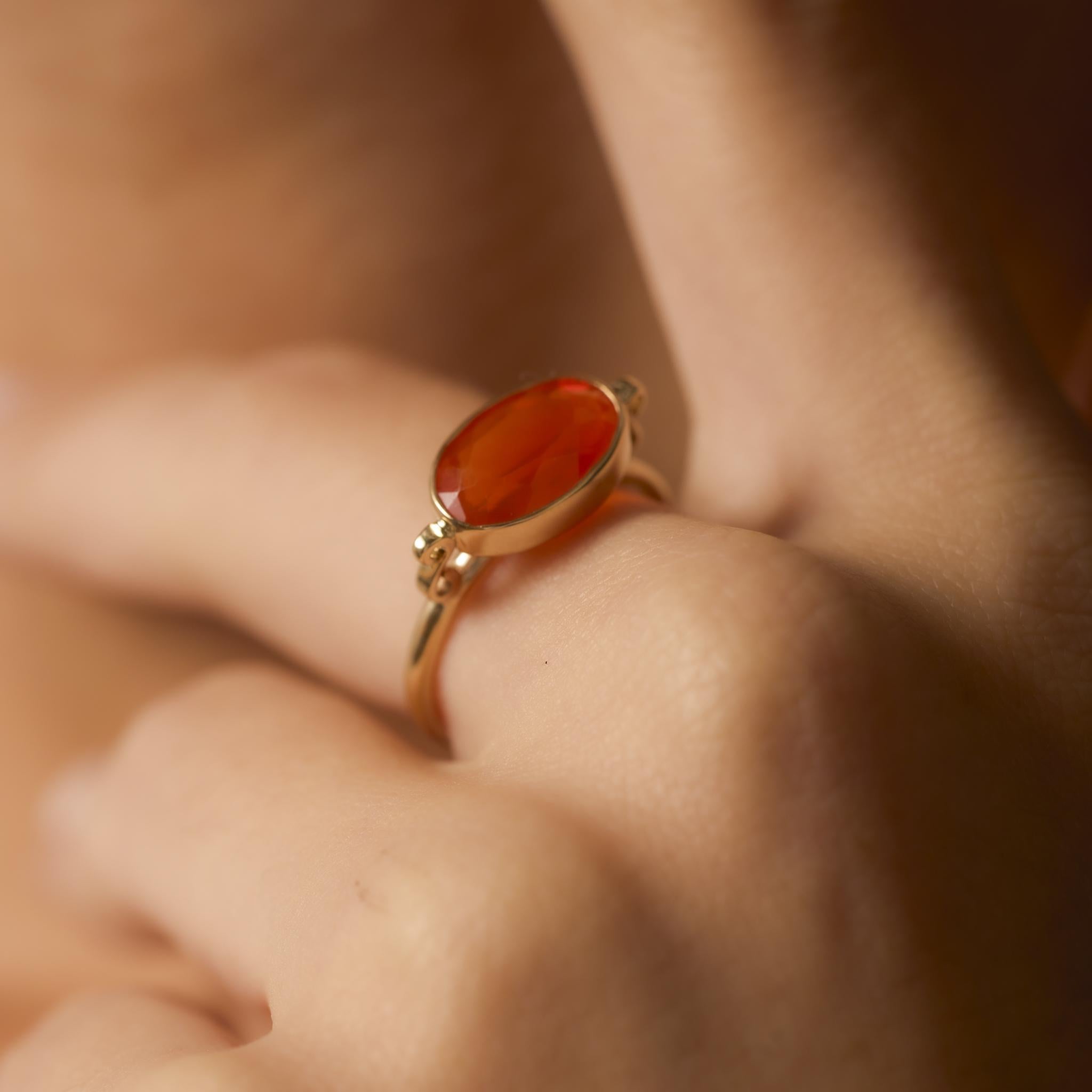 Contemporary 2.30 carat fire opal 14k yellow gold bezel ring In Excellent Condition For Sale In Beverly Hills, CA