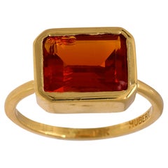 Contemporary 2.30 carat fire opal 18k yellow gold bezel ring