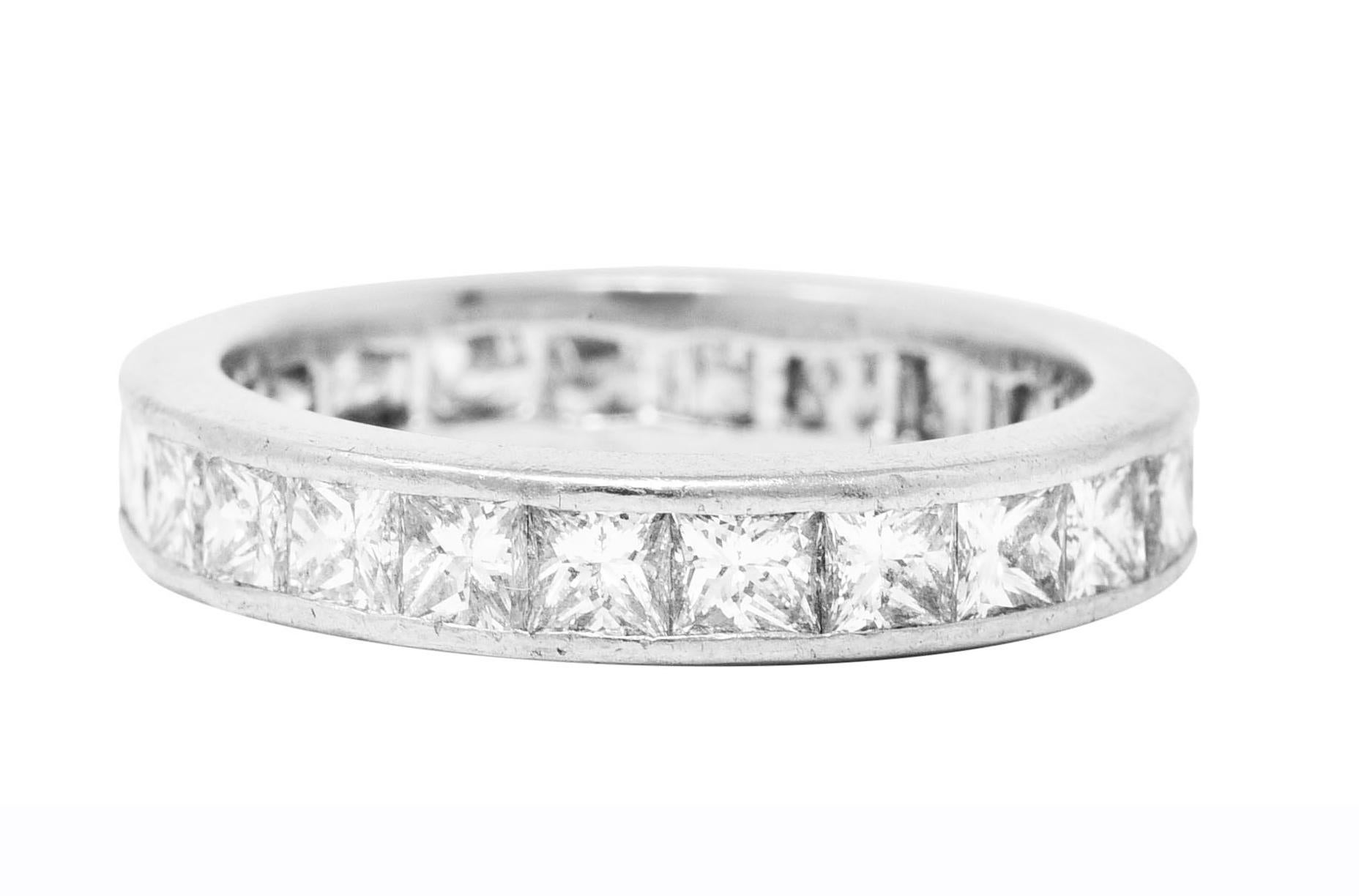 Band ring features princess cut diamonds channel set fully around

Weighing approximately 2.30 carat total - G/H in color with VS clarity

With high polished finish

Tested as platinum

Circa: Early 21st century

Ring size: 6 1/4 and not