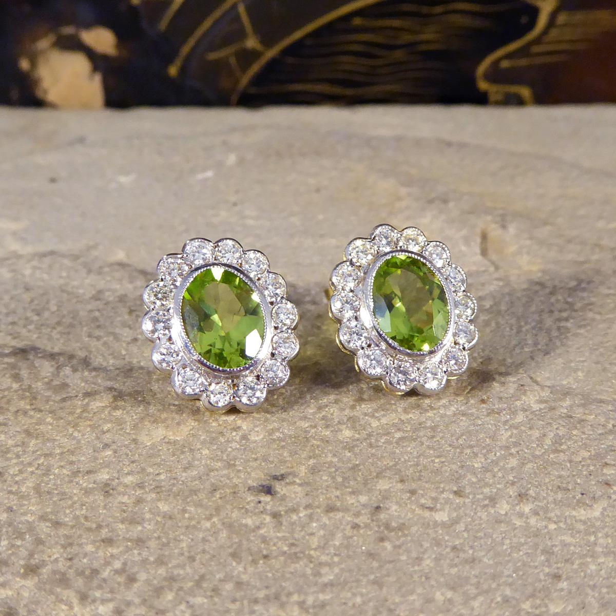 A perfect pair of oval cluster earrings bringing a bright and vibrant Peridot green centre. These earrings feature a 1.25ct Peridot in the core of each stud with a surround of 14 Round Brilliant Cut Diamond weight a total of 0.35ct in each ear. The