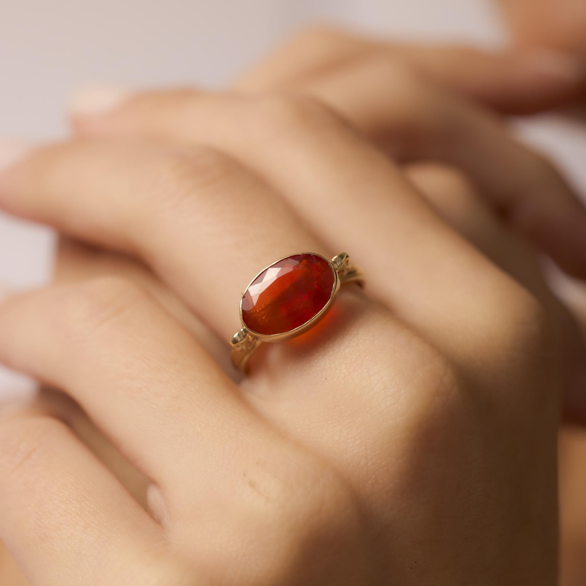 Contemporary 2.60 carat fire opal 14k yellow gold bezel ring In Excellent Condition For Sale In Beverly Hills, CA