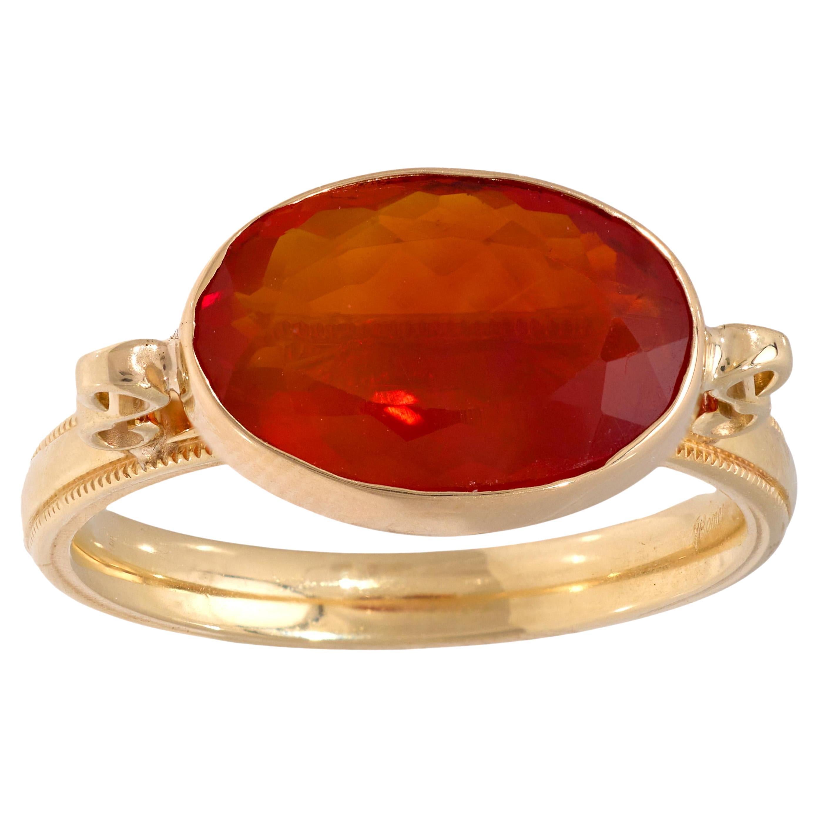 Contemporary 2.60 carat fire opal 14k yellow gold bezel ring